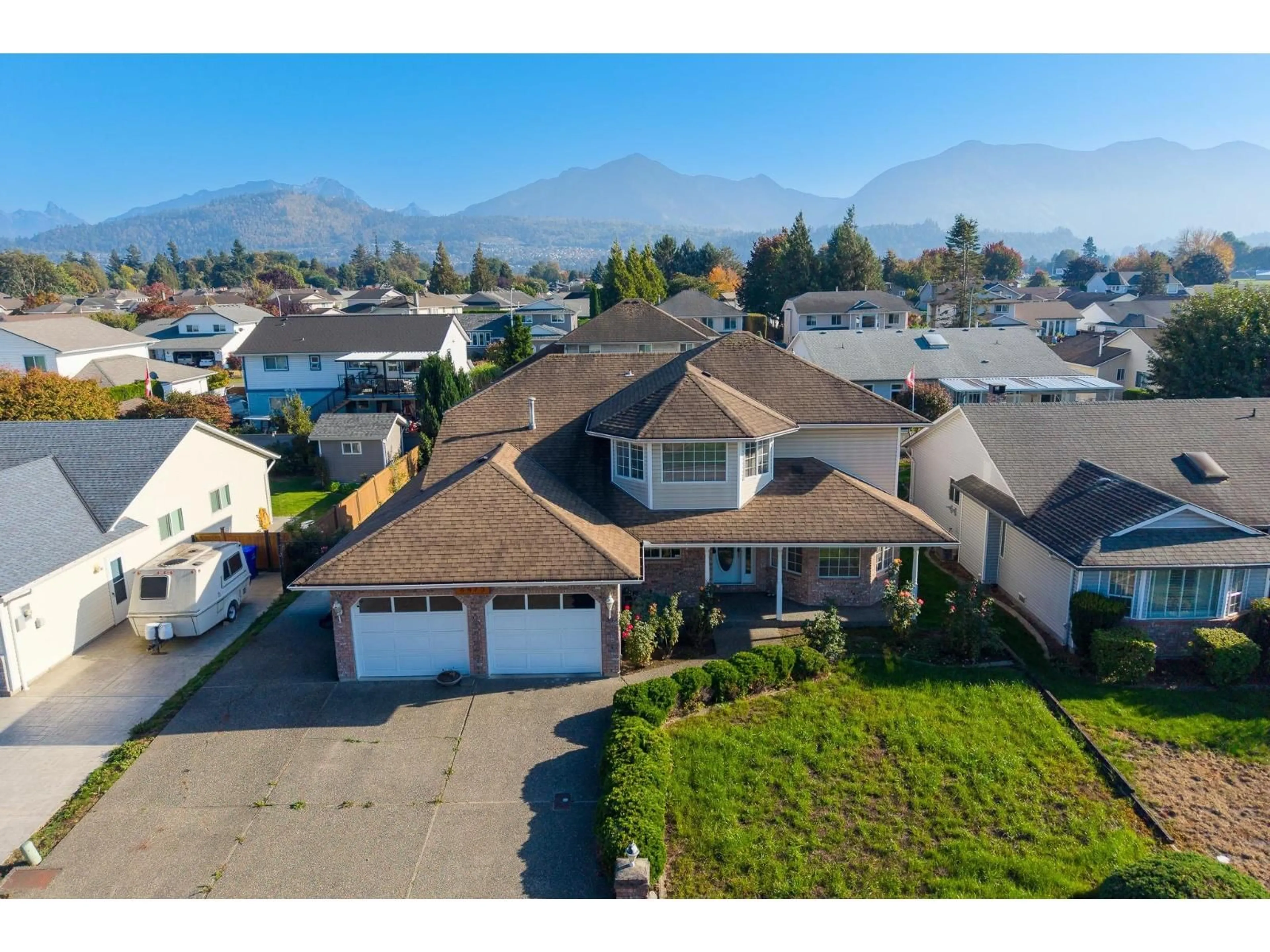 A pic from outside/outdoor area/front of a property/back of a property/a pic from drone, mountain view for 6973 COACH LAMP DRIVE, Chilliwack British Columbia V2R2Y7