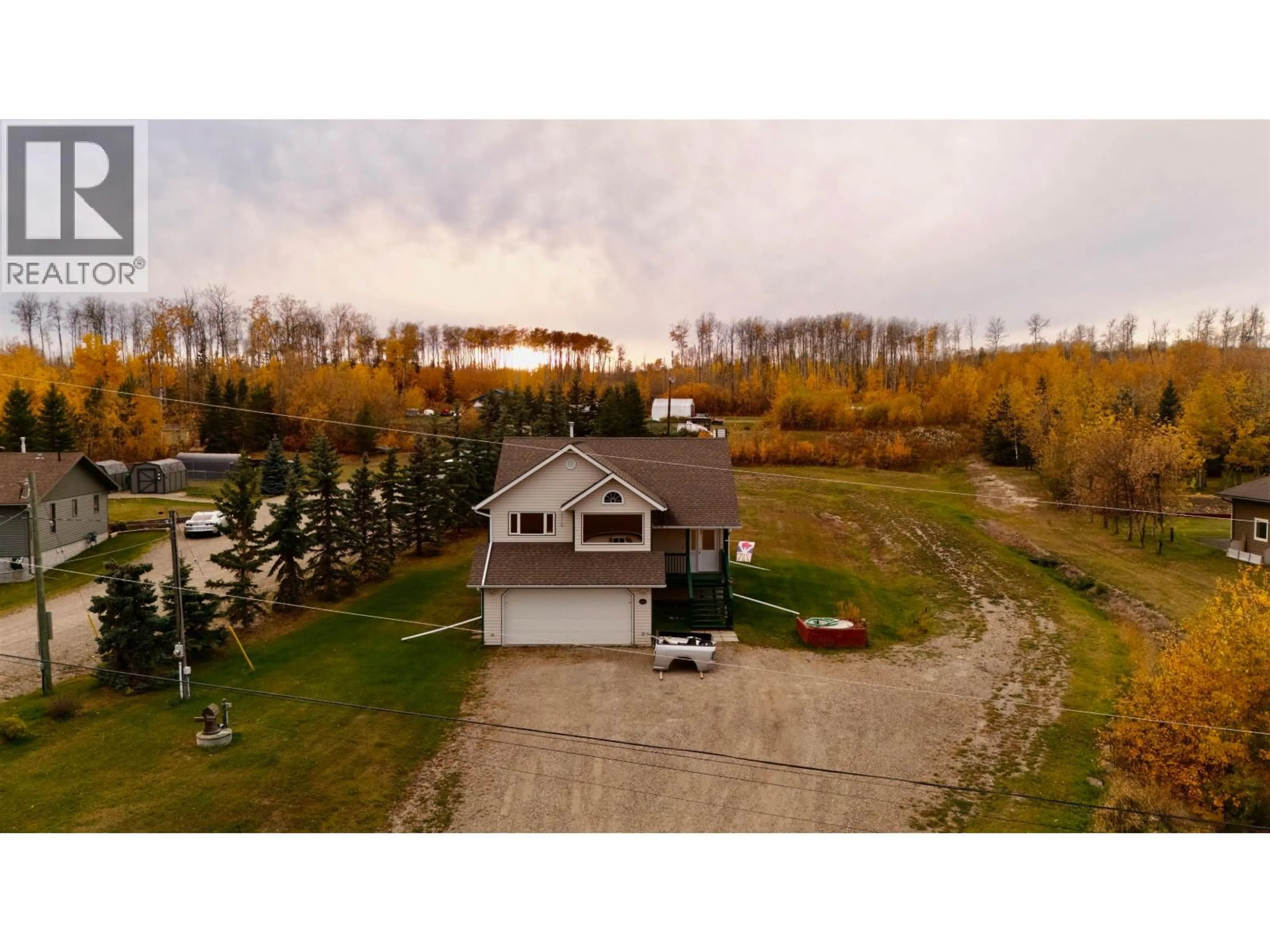 A pic from outside/outdoor area/front of a property/back of a property/a pic from drone, water/lake/river/ocean view for 12851 BENS ROAD, Charlie Lake British Columbia V0C1H0