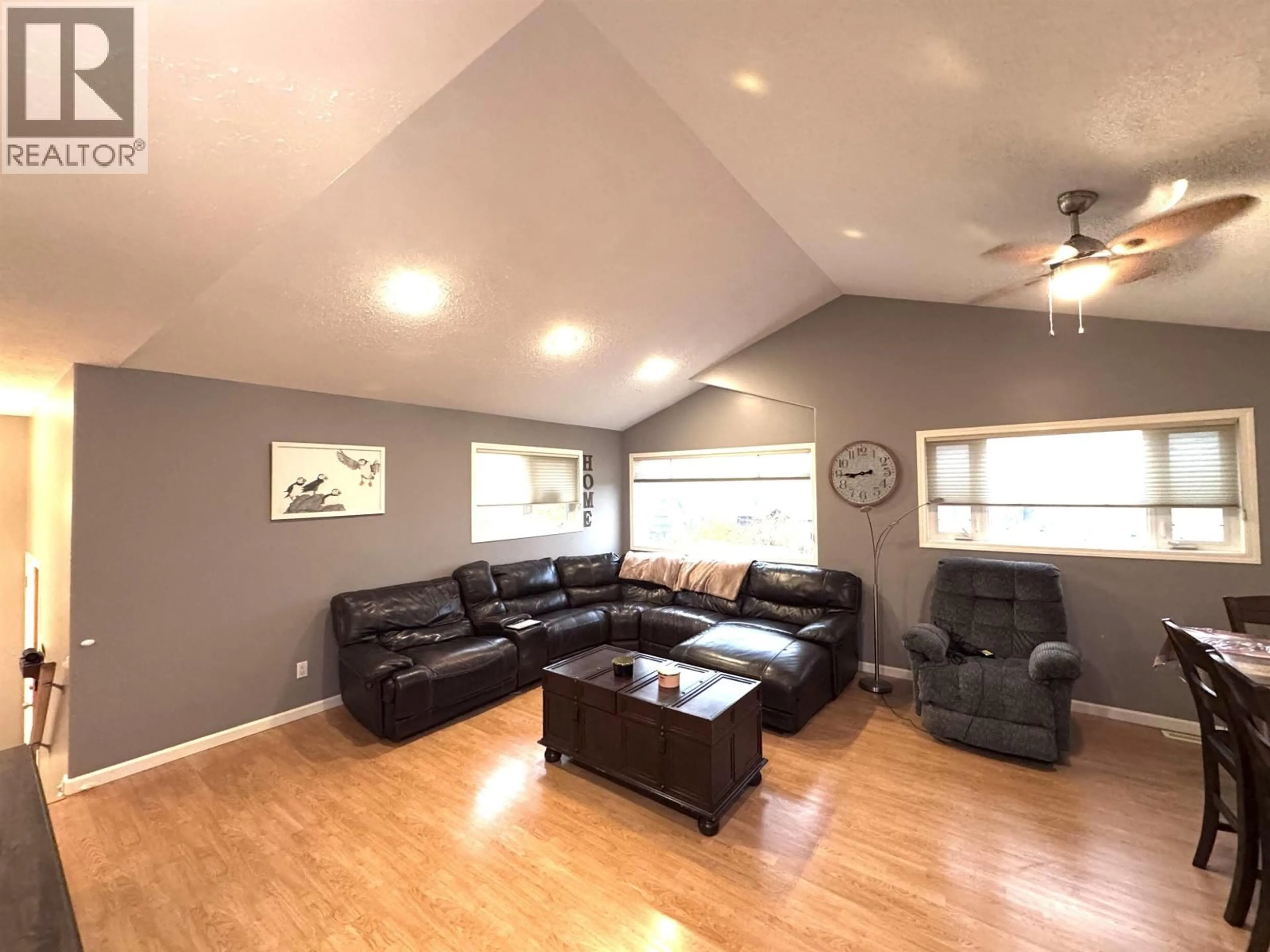 Living room with furniture, wood/laminate floor for 12851 BENS ROAD, Charlie Lake British Columbia V0C1H0