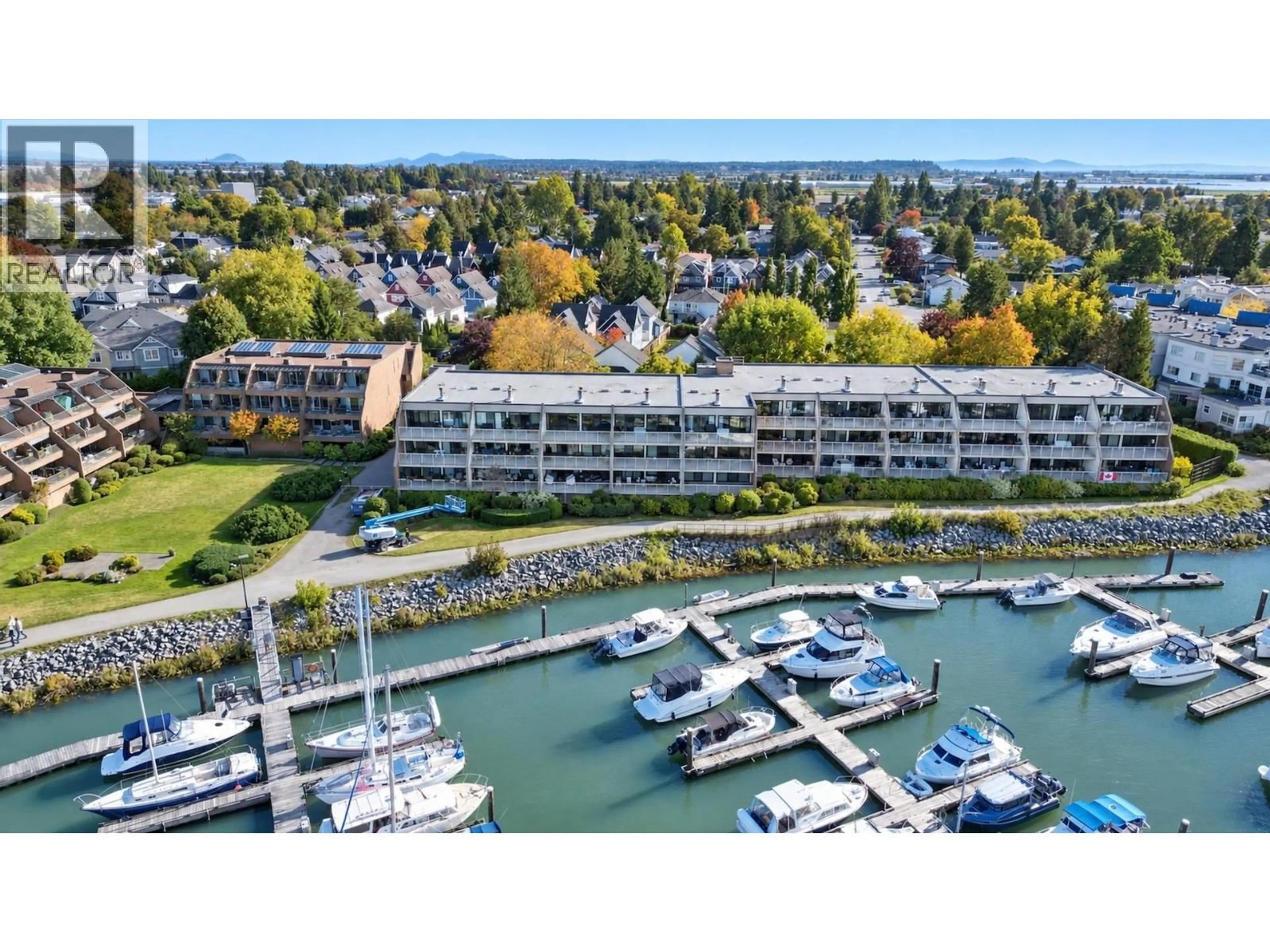 A pic from outside/outdoor area/front of a property/back of a property/a pic from drone, water/lake/river/ocean view for 204 - 4803 48 AVENUE, Delta British Columbia V4K1V2