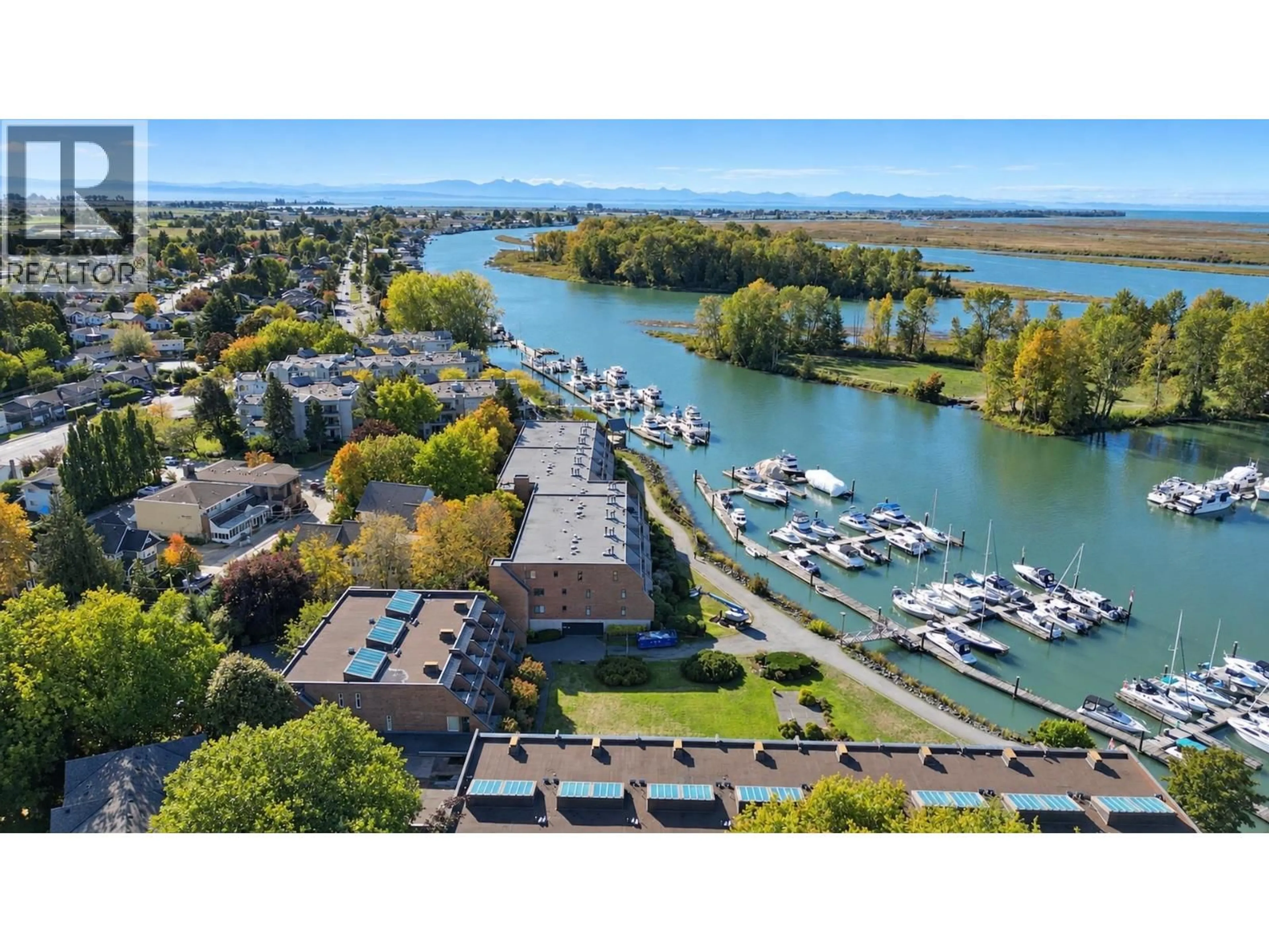 A pic from outside/outdoor area/front of a property/back of a property/a pic from drone, water/lake/river/ocean view for 204 - 4803 48 AVENUE, Delta British Columbia V4K1V2