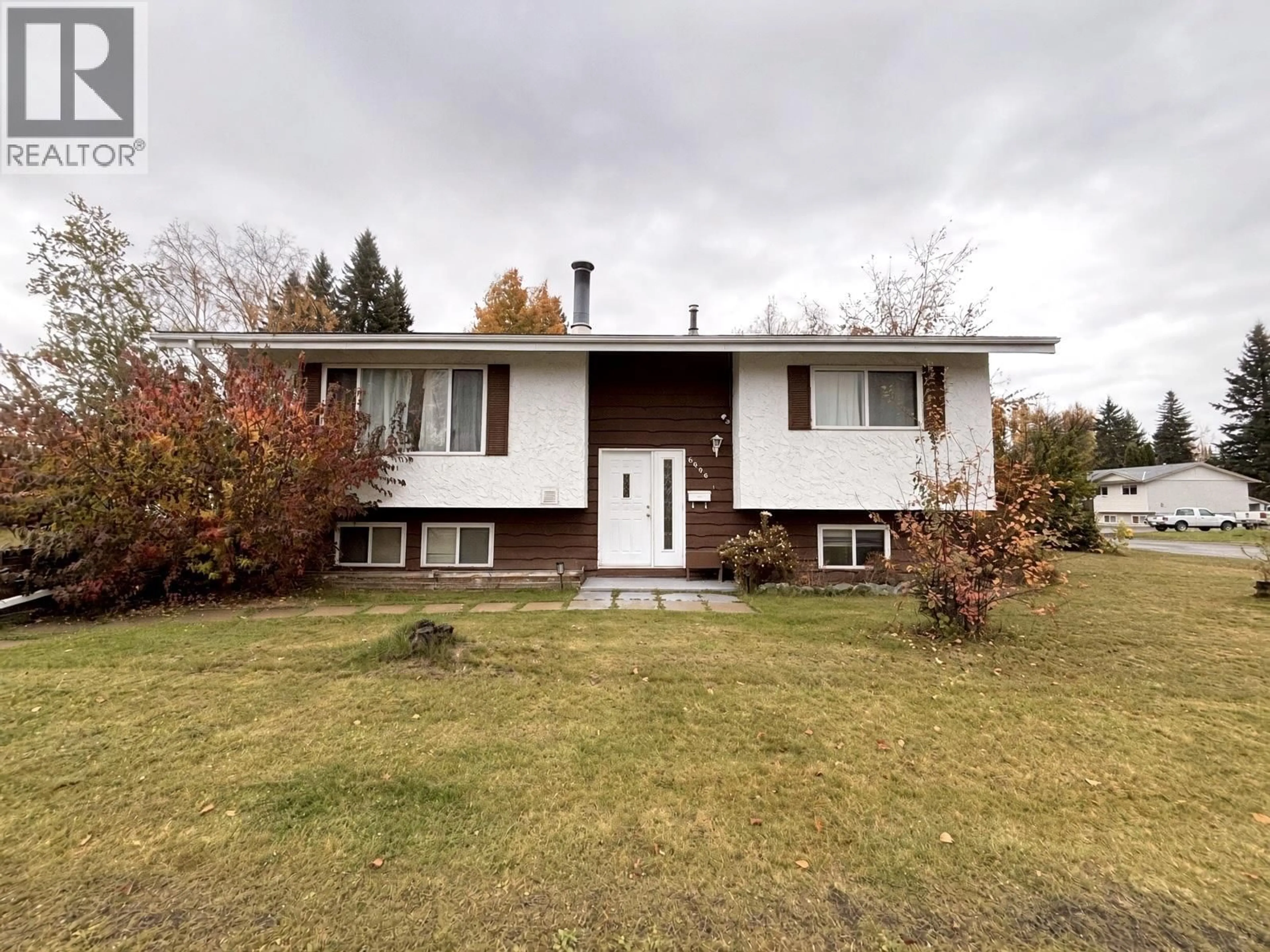Home with vinyl exterior material, street for 6696 SIMON FRASER AVENUE, Prince George British Columbia V2N2P4