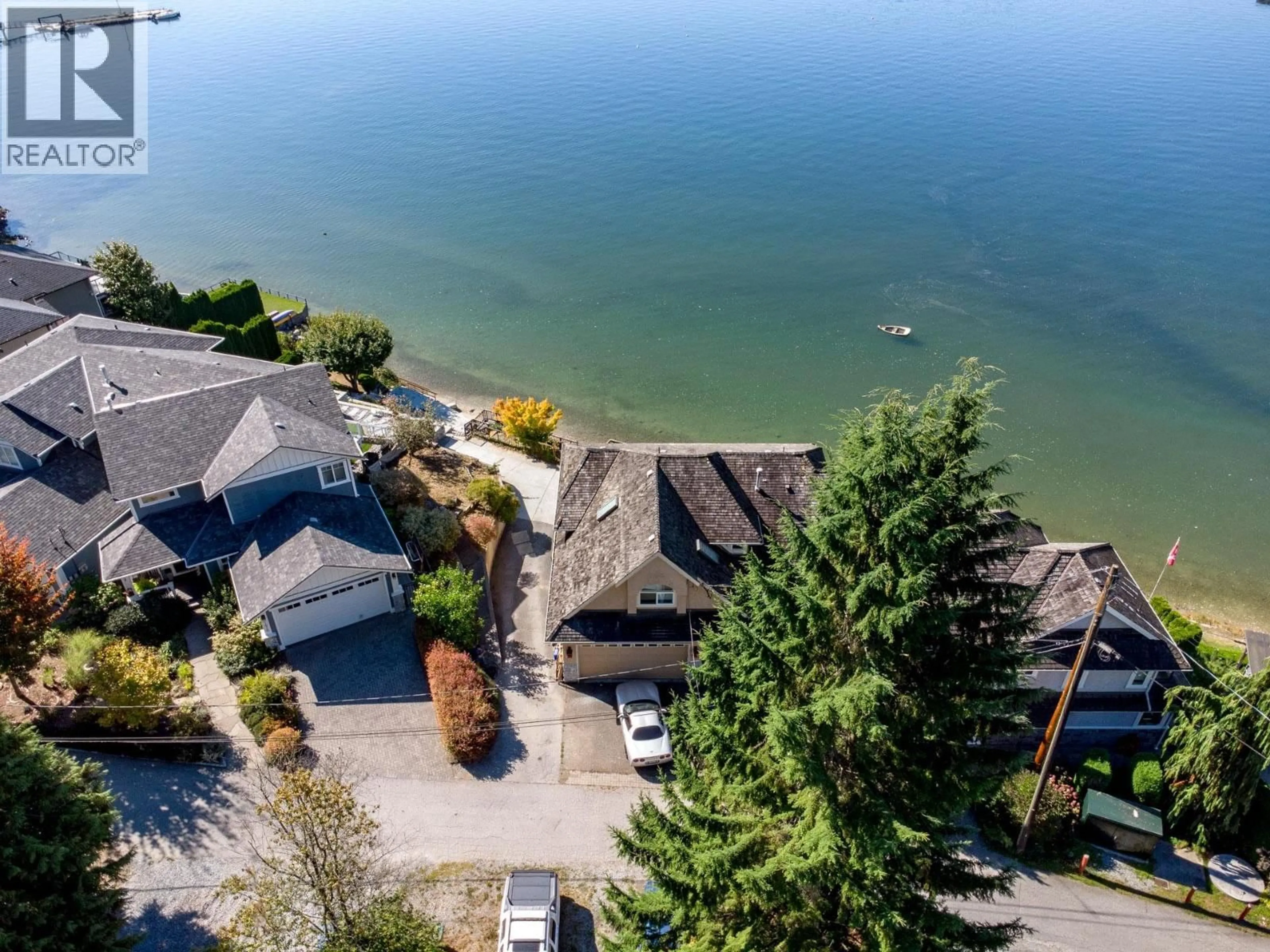 A pic from outside/outdoor area/front of a property/back of a property/a pic from drone, water/lake/river/ocean view for 1678 BEACH AVENUE, Port Moody British Columbia V3H3M1