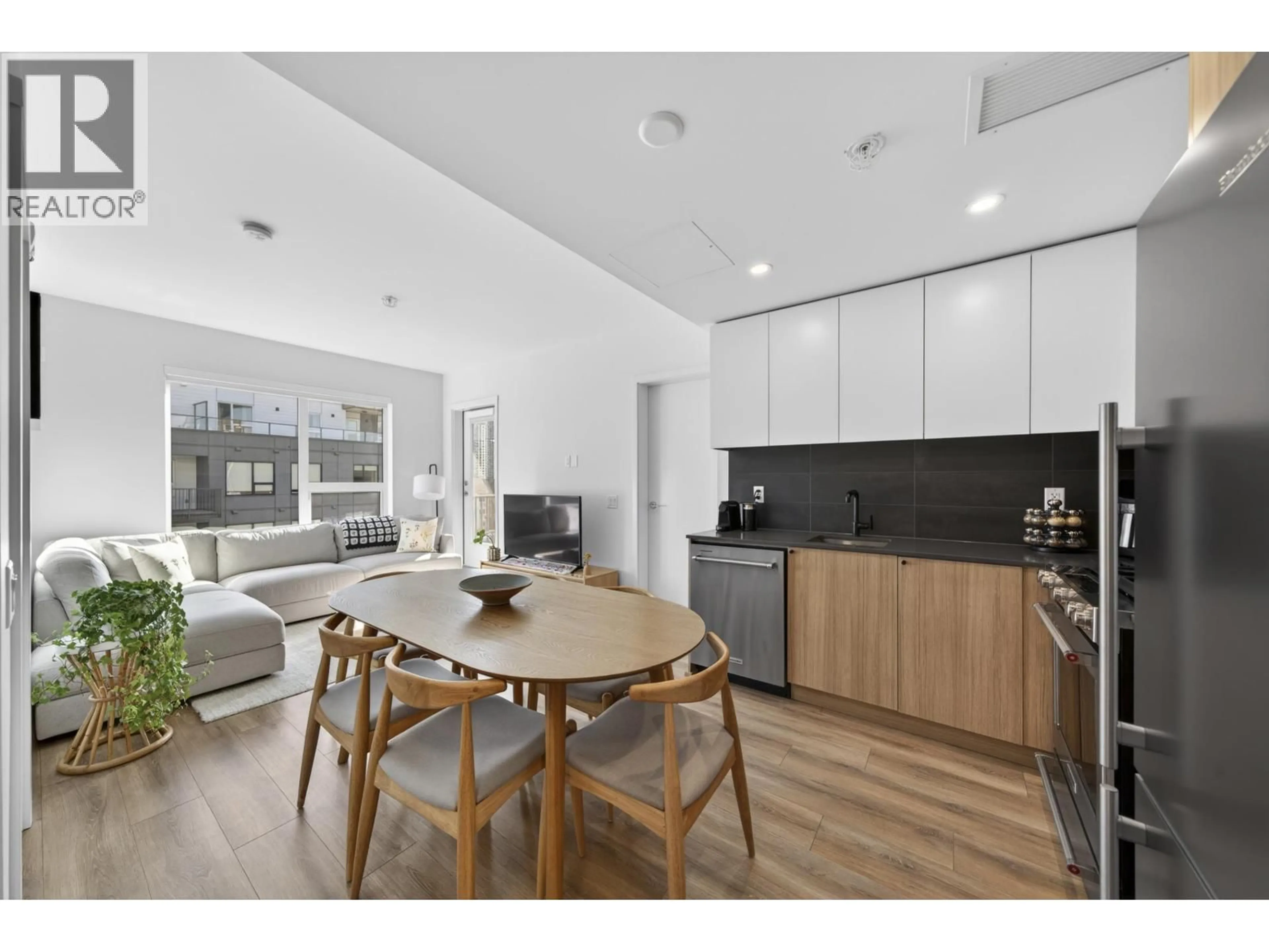 Open concept kitchen, wood/laminate floor for 404 - 648 LEA AVENUE, Coquitlam British Columbia V3J0P1