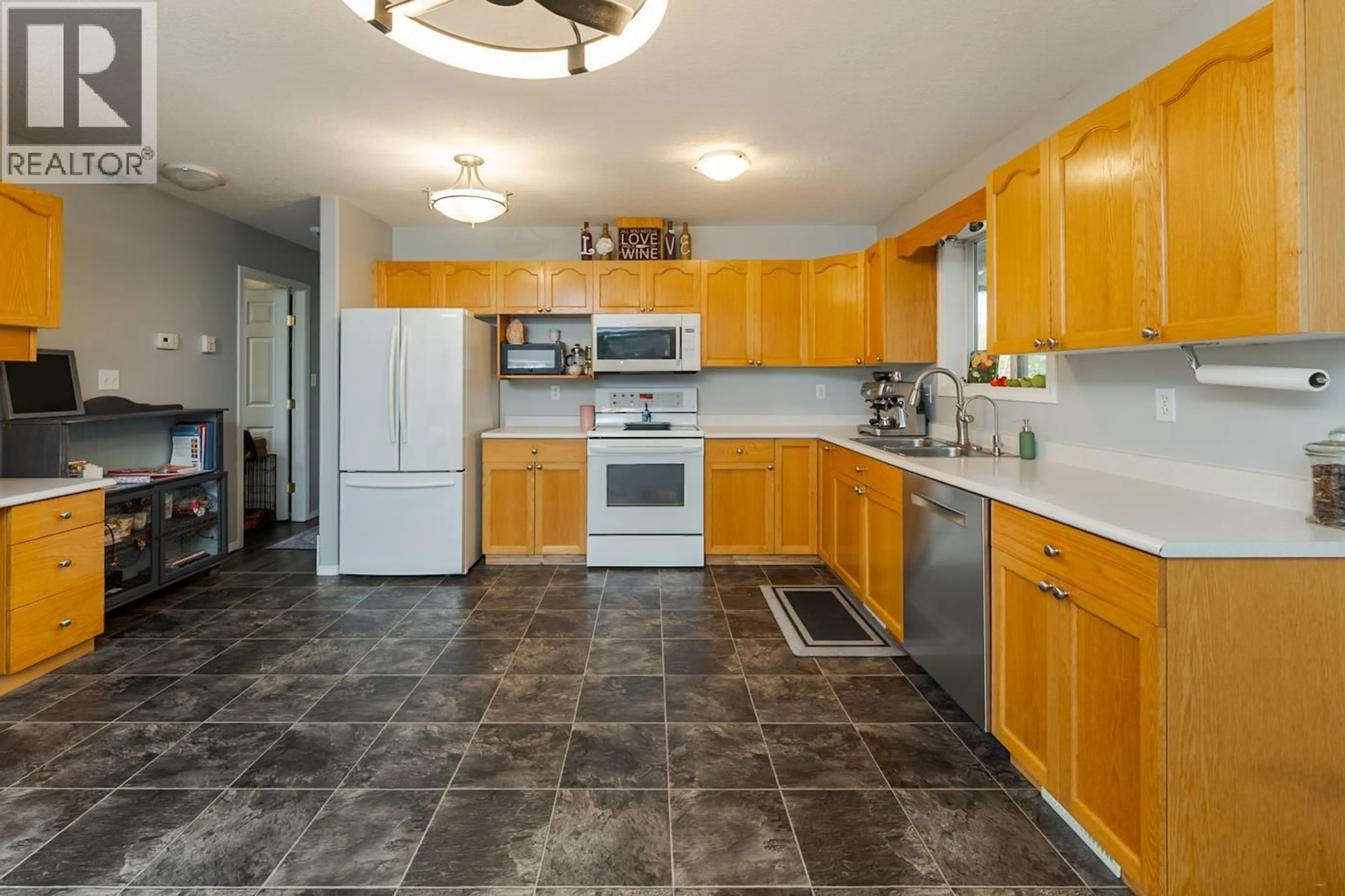 Standard kitchen, ceramic/tile floor for 5556 LEHMAN STREET, Prince George British Columbia V2K4P2