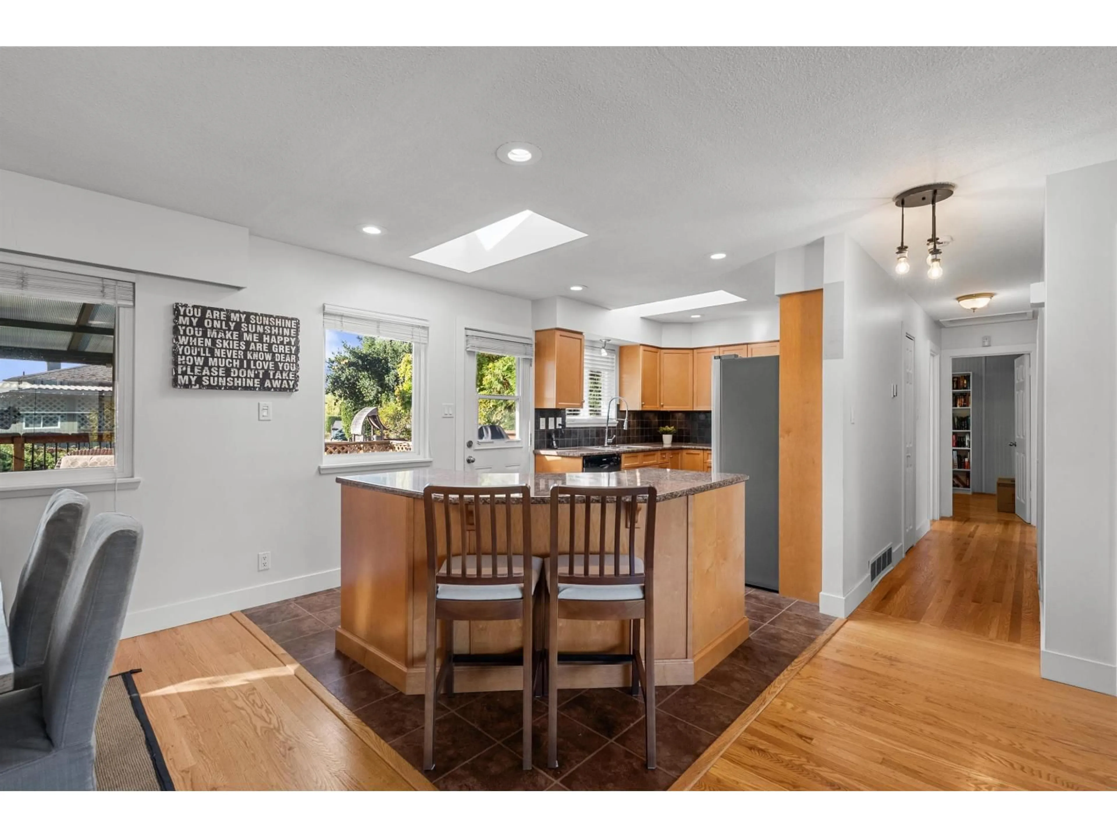 Open concept kitchen, wood/laminate floor for 8203 109B STREET, Delta British Columbia V4C4G9