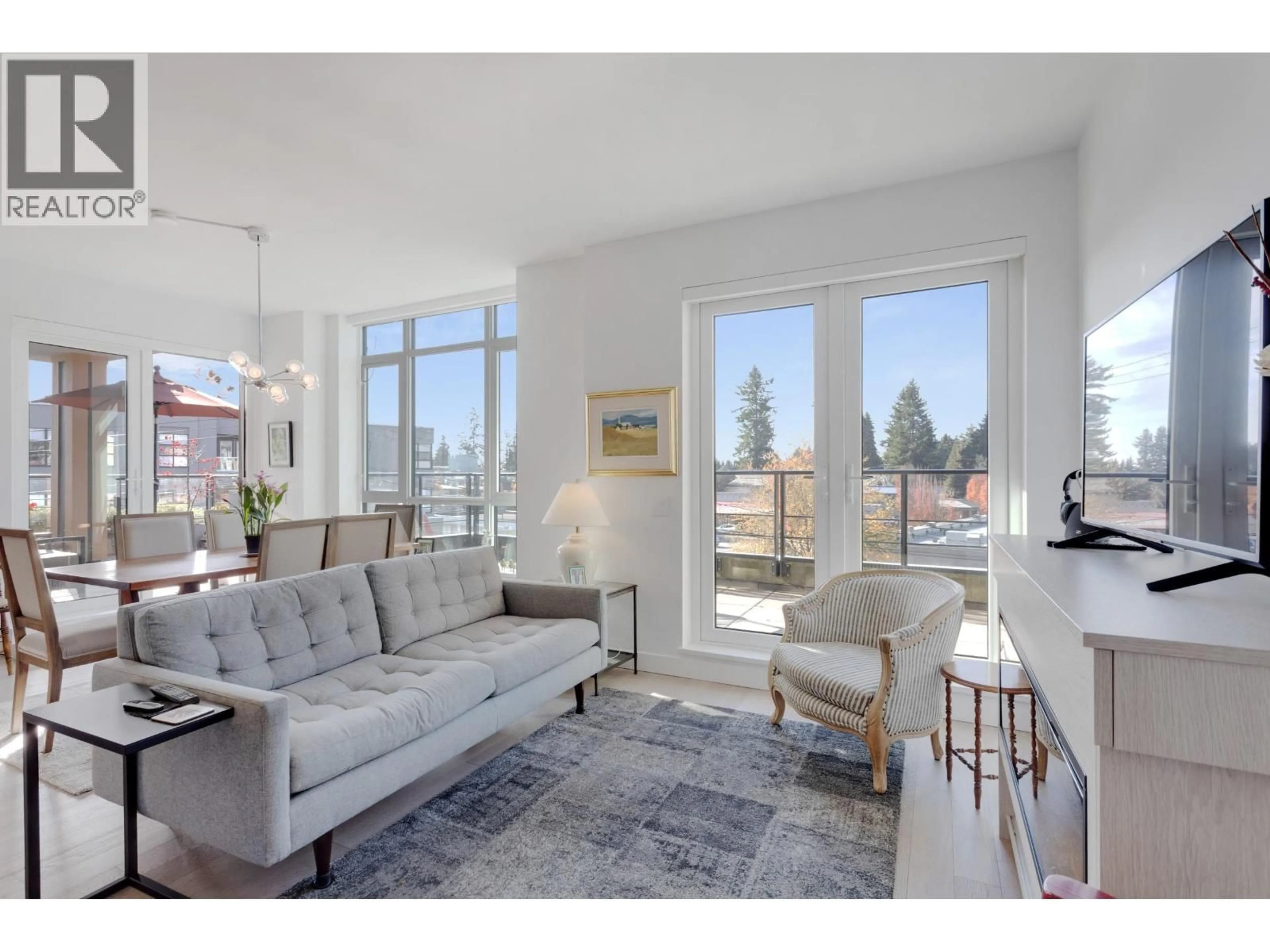 Living room with furniture, unknown for 206 - 3220 CONNAUGHT CRESCENT, North Vancouver British Columbia V7R0A5