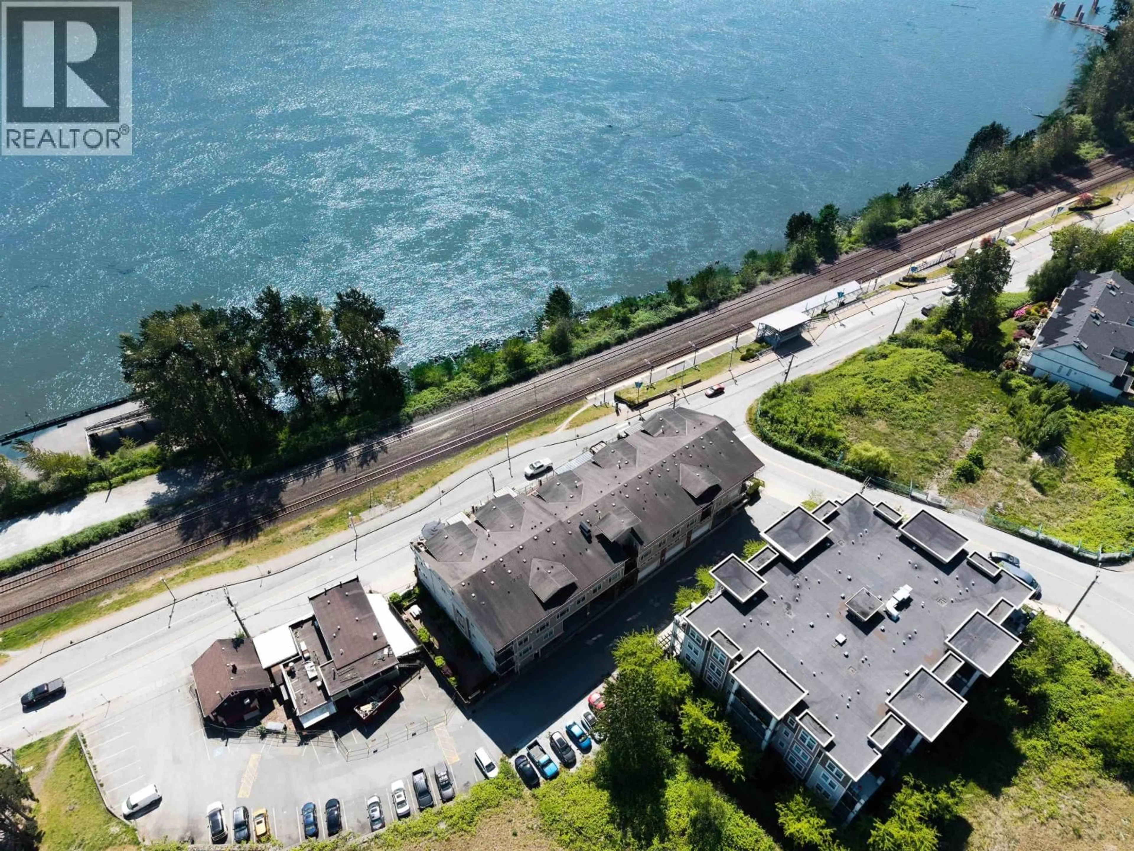 A pic from outside/outdoor area/front of a property/back of a property/a pic from drone, water/lake/river/ocean view for 311 - 22327 RIVER ROAD, Maple Ridge British Columbia V2X9C8