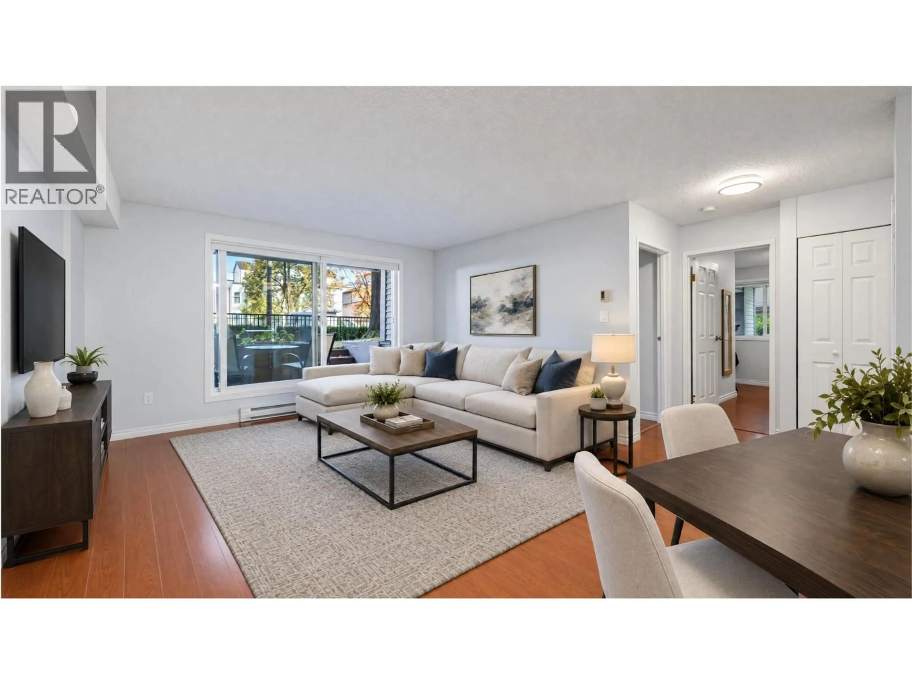 Living room with furniture, wood/laminate floor for 101 - 1040 BROADWAY, Vancouver British Columbia V5T4N7