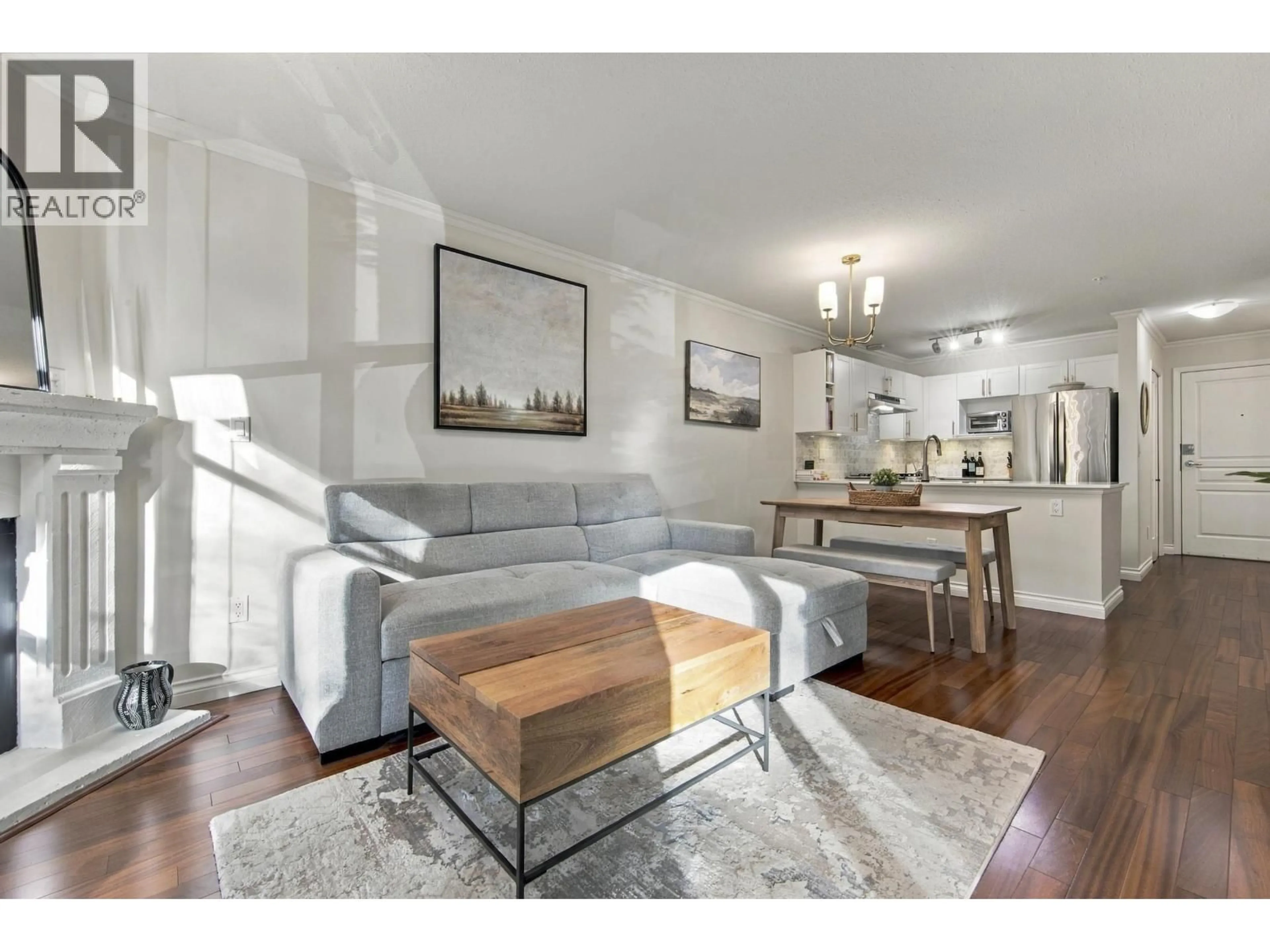 Living room with furniture, wood/laminate floor for 210 - 2181 10TH AVENUE, Vancouver British Columbia V6K2H7