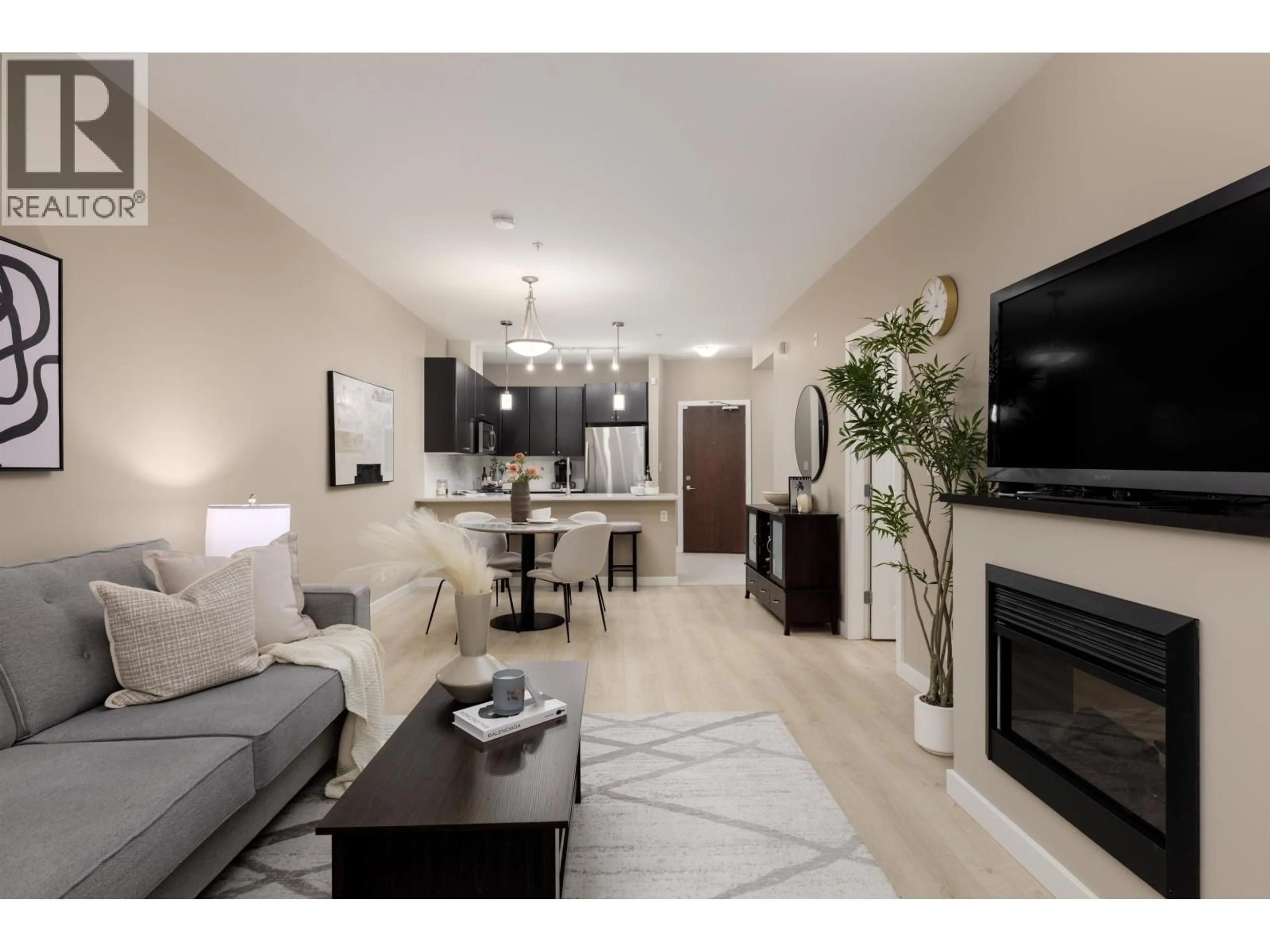 Living room with furniture, unknown for 105 - 225 FRANCIS WAY, New Westminster British Columbia V3L0G1