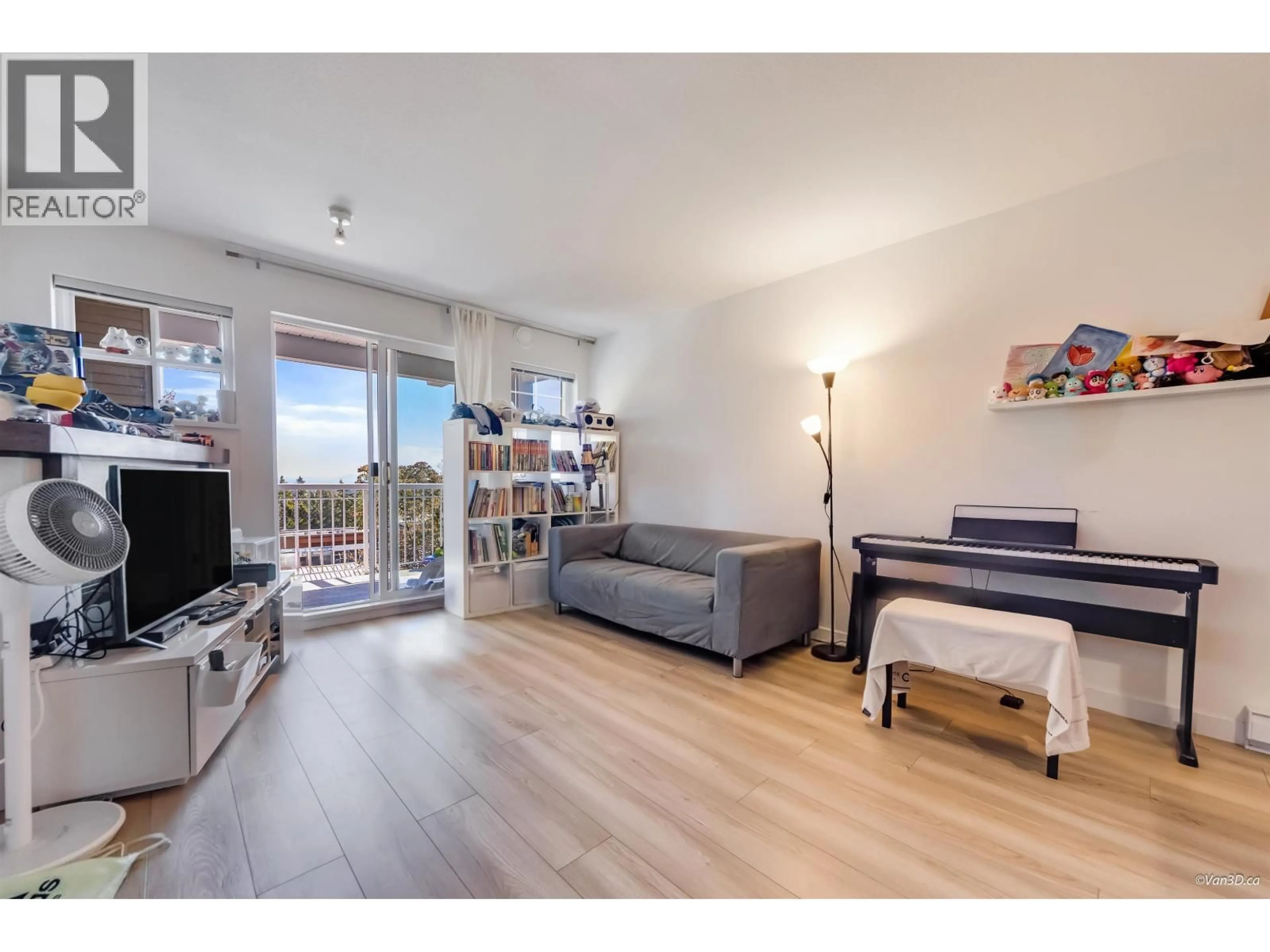 Living room with furniture, wood/laminate floor for 208 - 1420 PARKWAY BOULEVARD, Coquitlam British Columbia V3E3J6