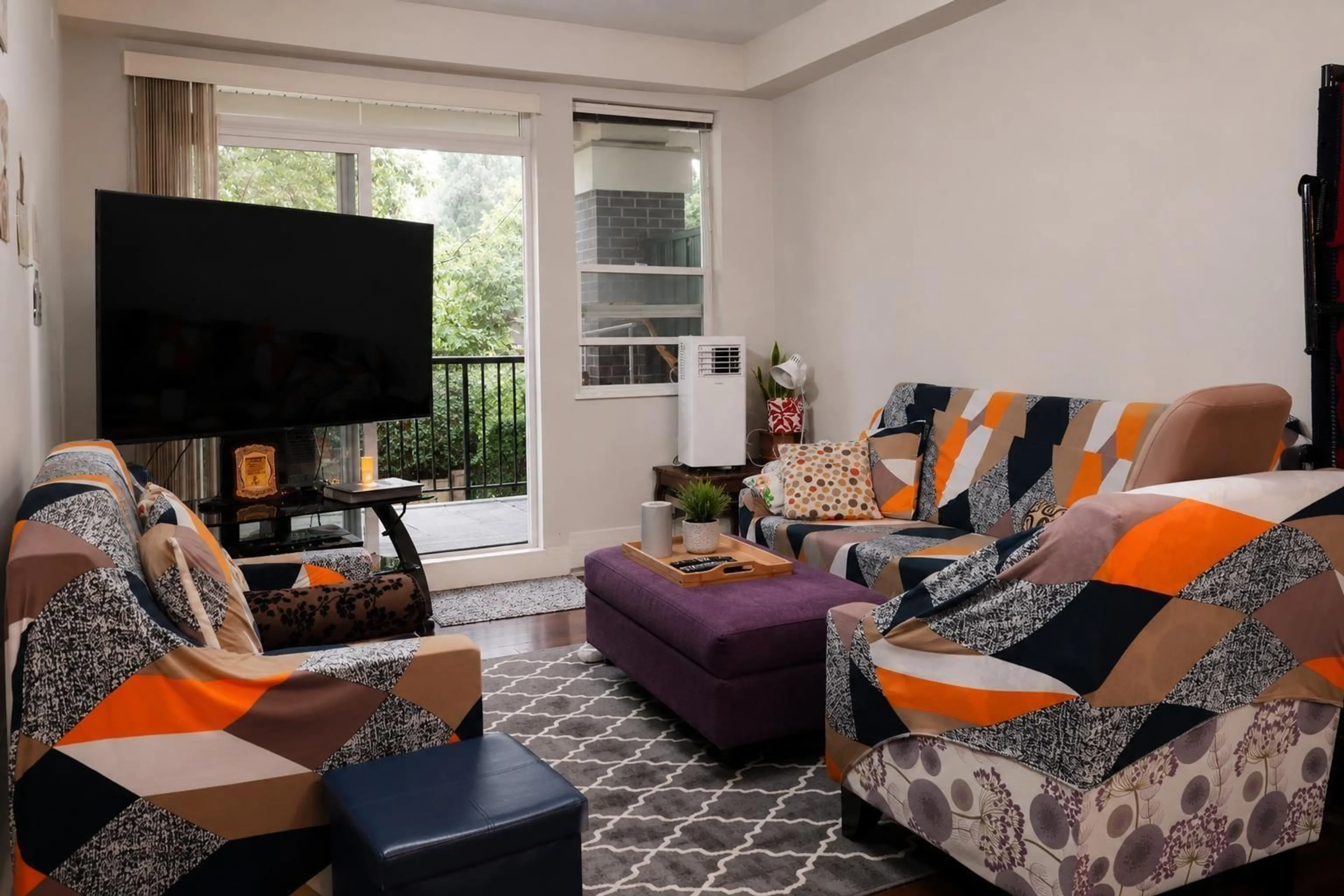 Living room with furniture, carpet floor for 123 - 9655 KING GEORGE BLVD BOULEVARD, Surrey British Columbia V3T2V3