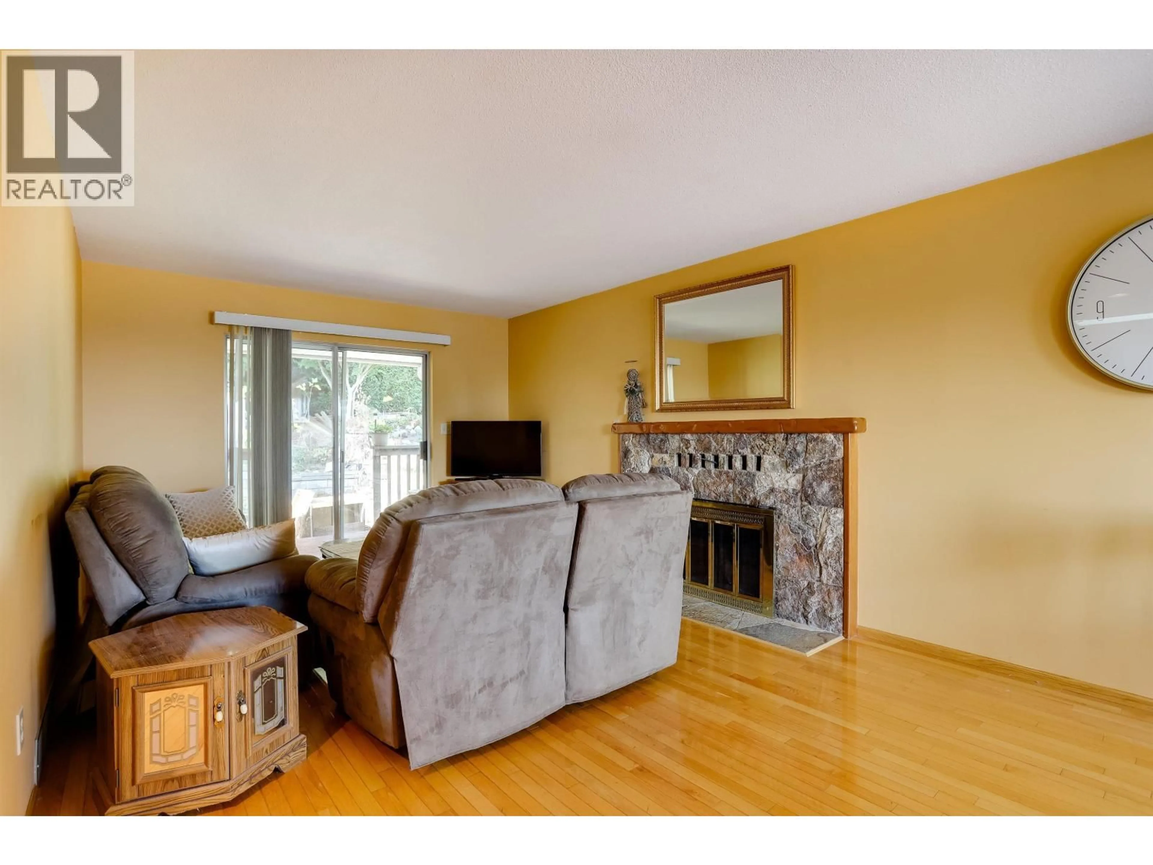 Living room with furniture, wood/laminate floor for 468 CARIBOO CRESCENT, Coquitlam British Columbia V3C4X7