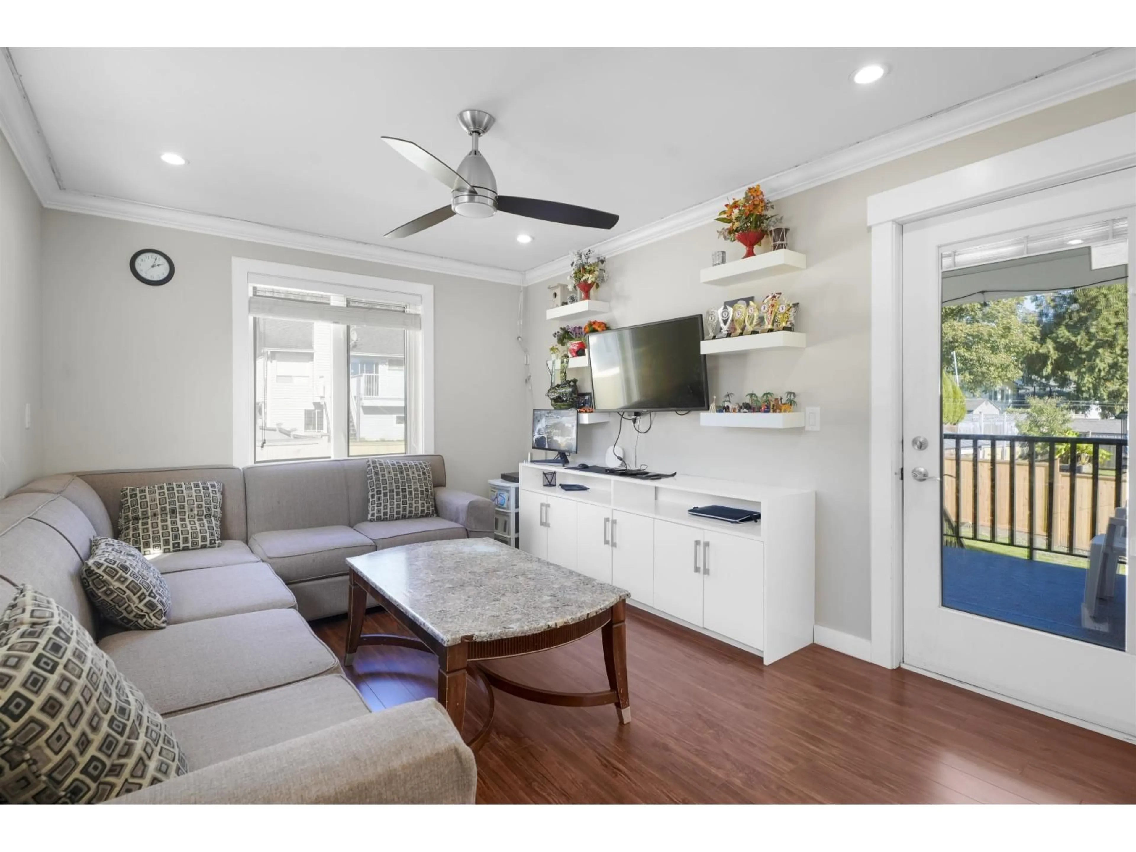 Living room with furniture, wood/laminate floor for 14217 67 AVENUE, Surrey British Columbia V3W0P5