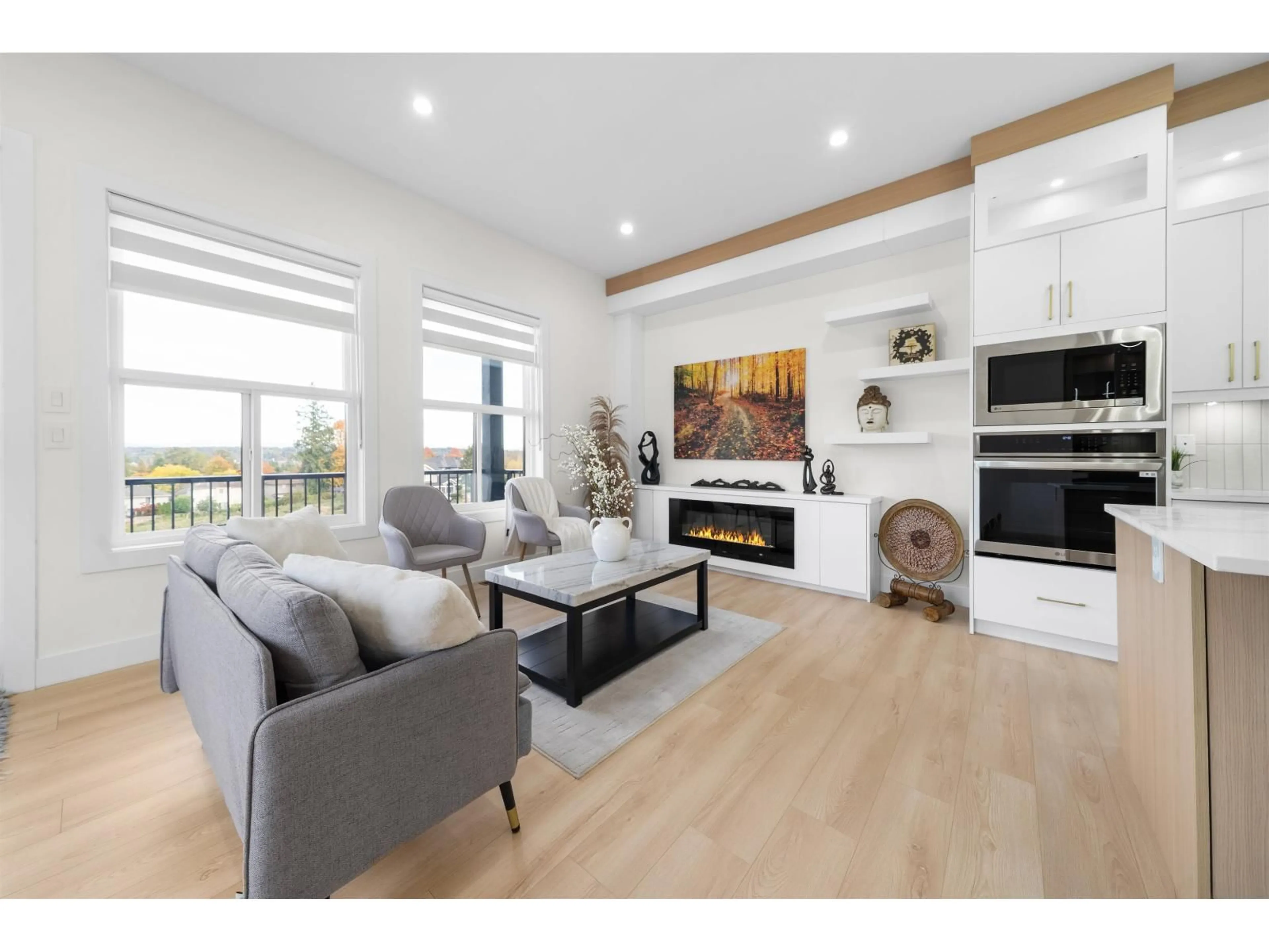 Living room with furniture, wood/laminate floor for 101 - 8148 168 STREET, Surrey British Columbia V4N4Y8