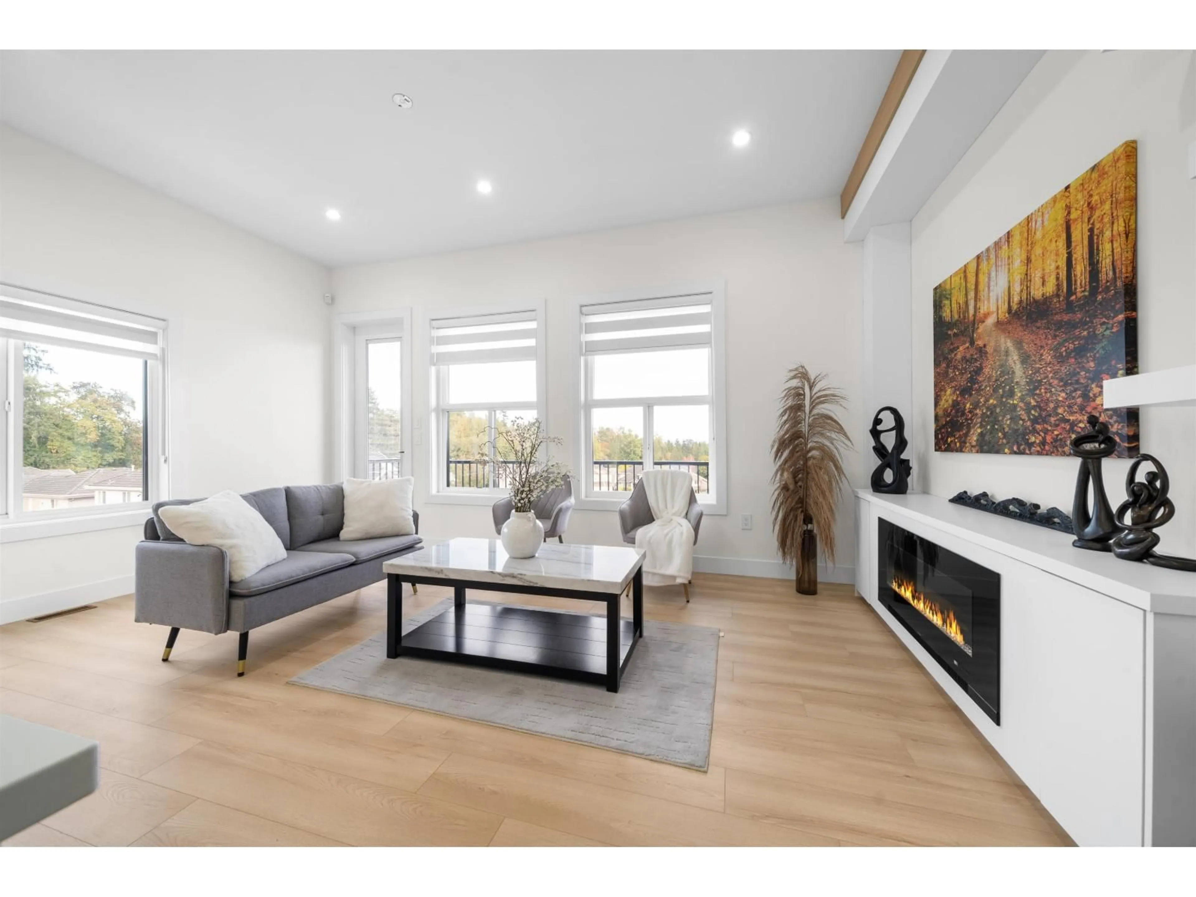 Living room with furniture, wood/laminate floor for 101 - 8148 168 STREET, Surrey British Columbia V4N4Y8