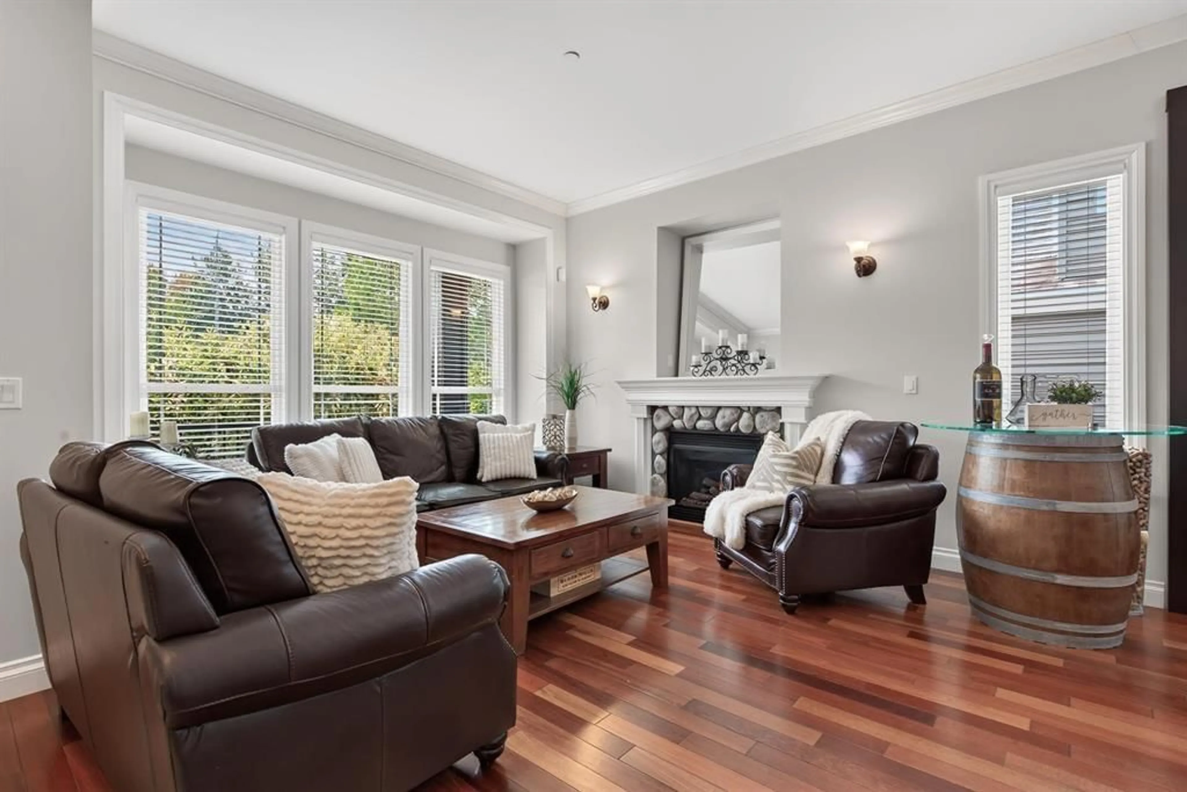 Living room with furniture, wood/laminate floor for 21857 51 AVENUE, Langley British Columbia V3A8P7