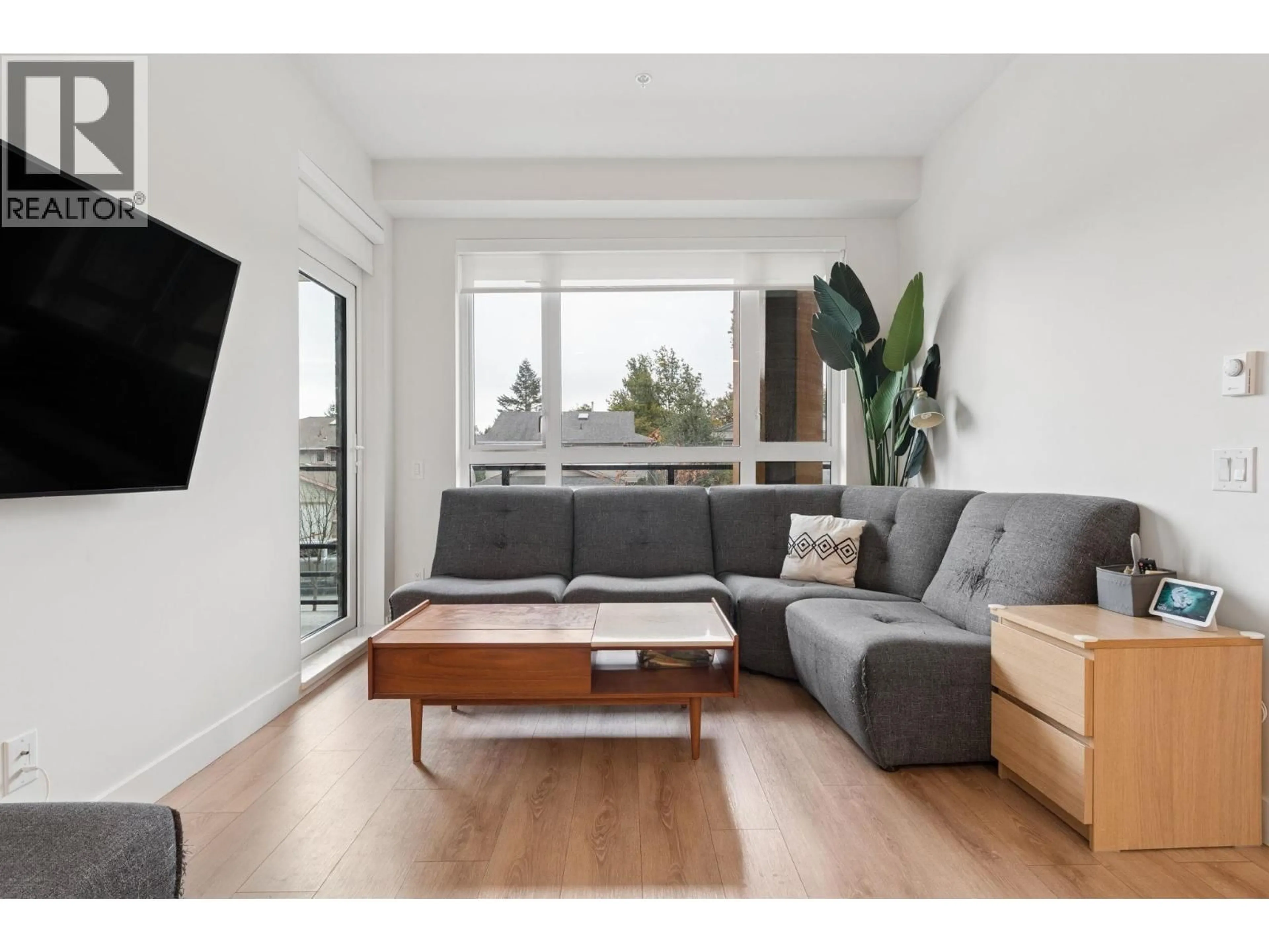 Living room with furniture, wood/laminate floor for 219 - 741 ANSKAR COURT, Coquitlam British Columbia V3J0N3