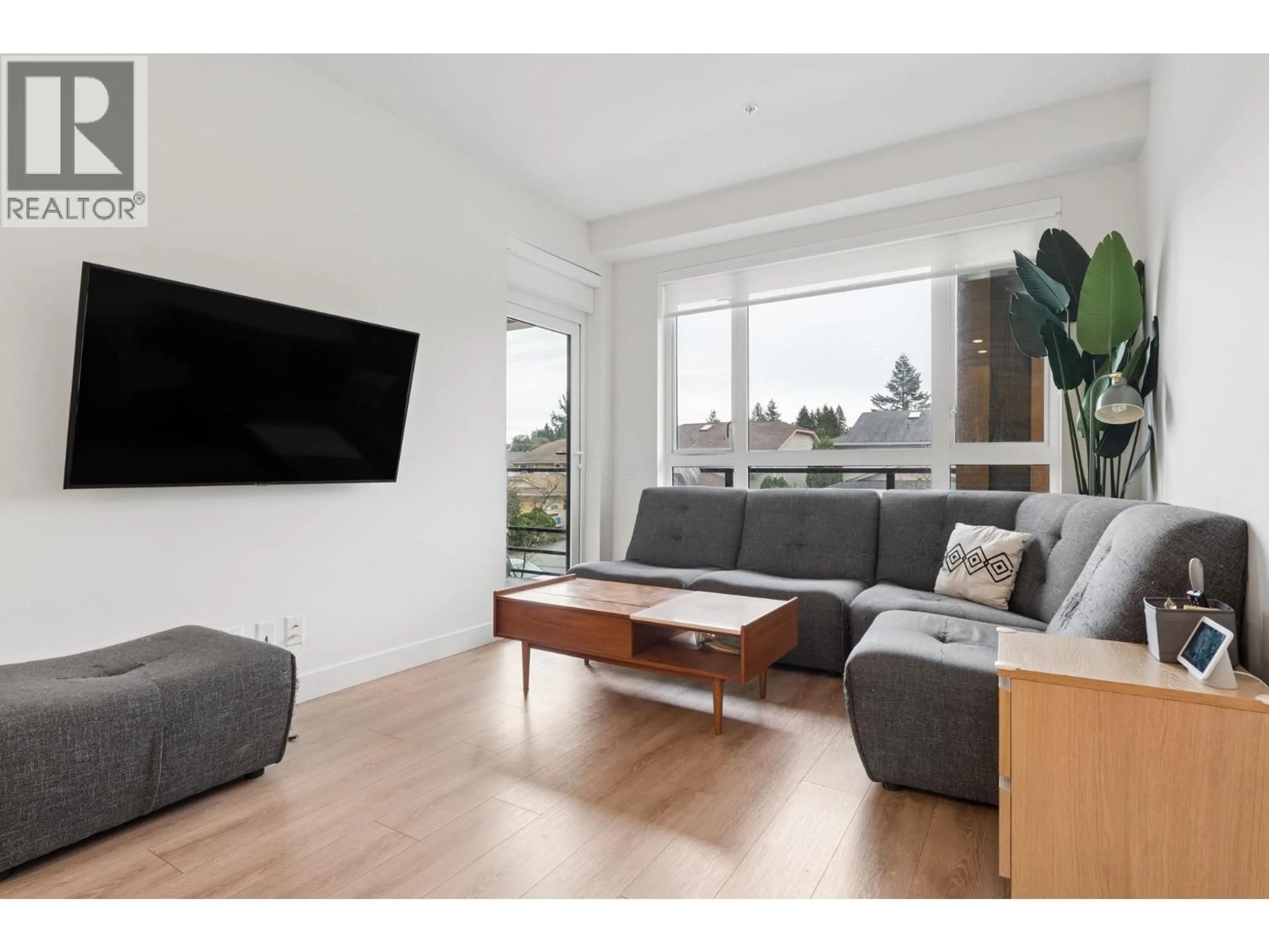 Living room with furniture, wood/laminate floor for 219 - 741 ANSKAR COURT, Coquitlam British Columbia V3J0N3