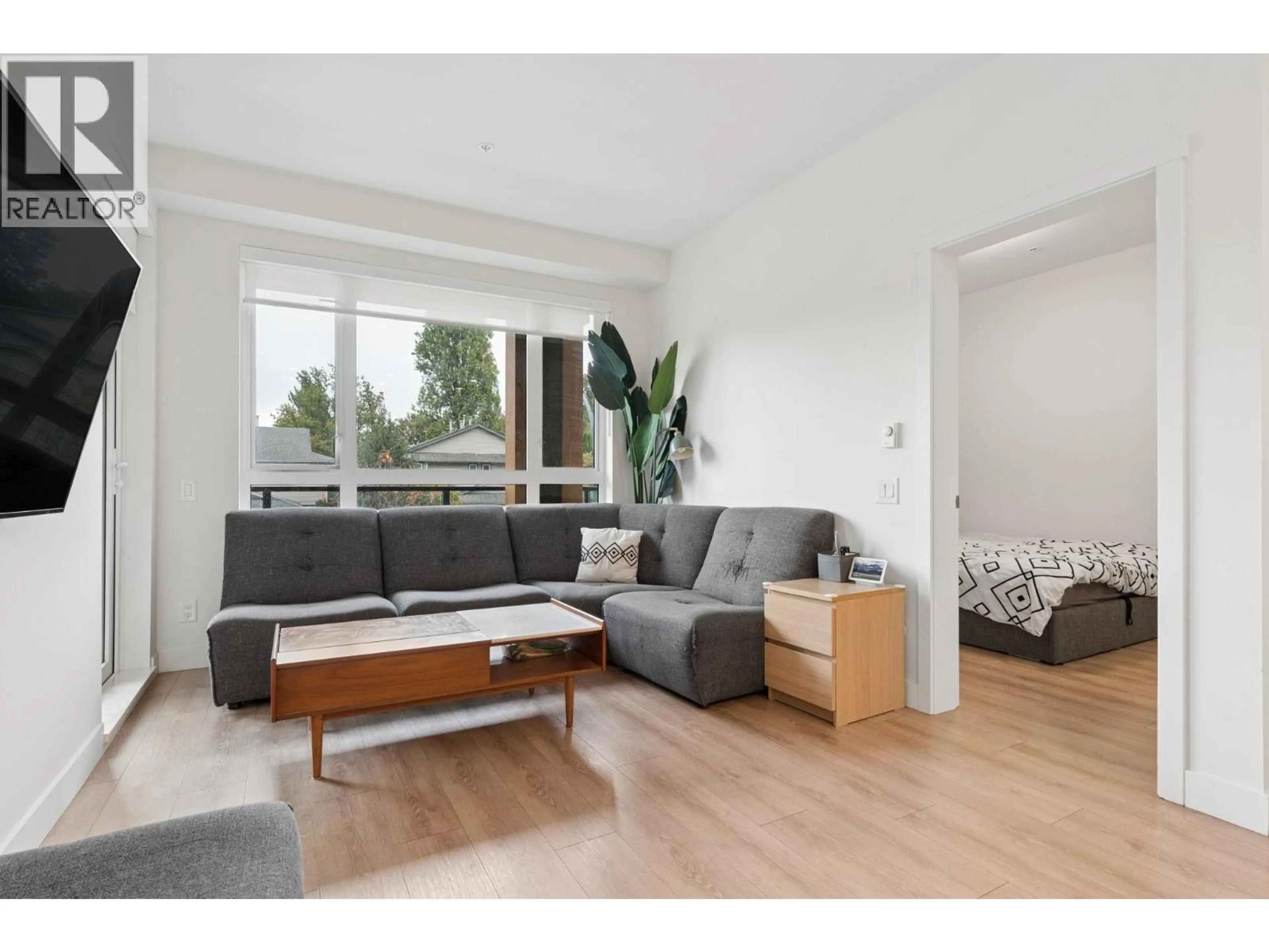 Living room with furniture, wood/laminate floor for 219 - 741 ANSKAR COURT, Coquitlam British Columbia V3J0N3