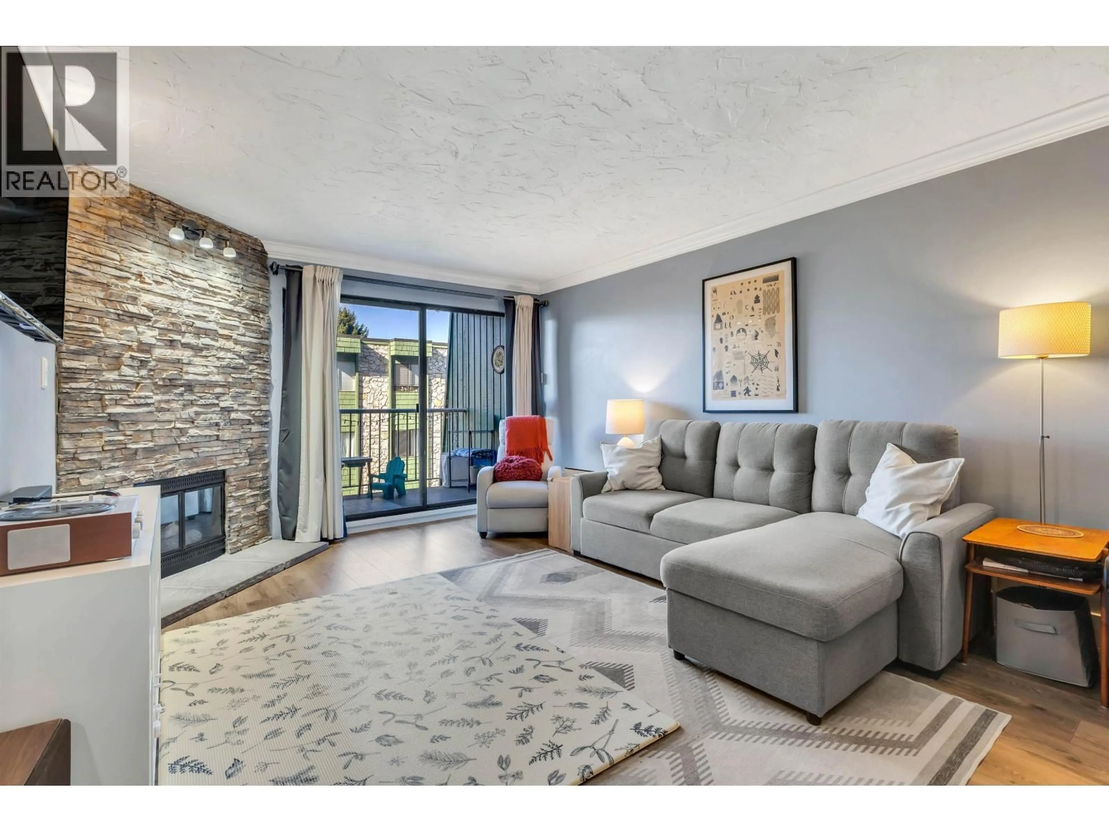 Living room with furniture, unknown for 207 - 3901 CARRIGAN COURT, Burnaby British Columbia V3N4K1