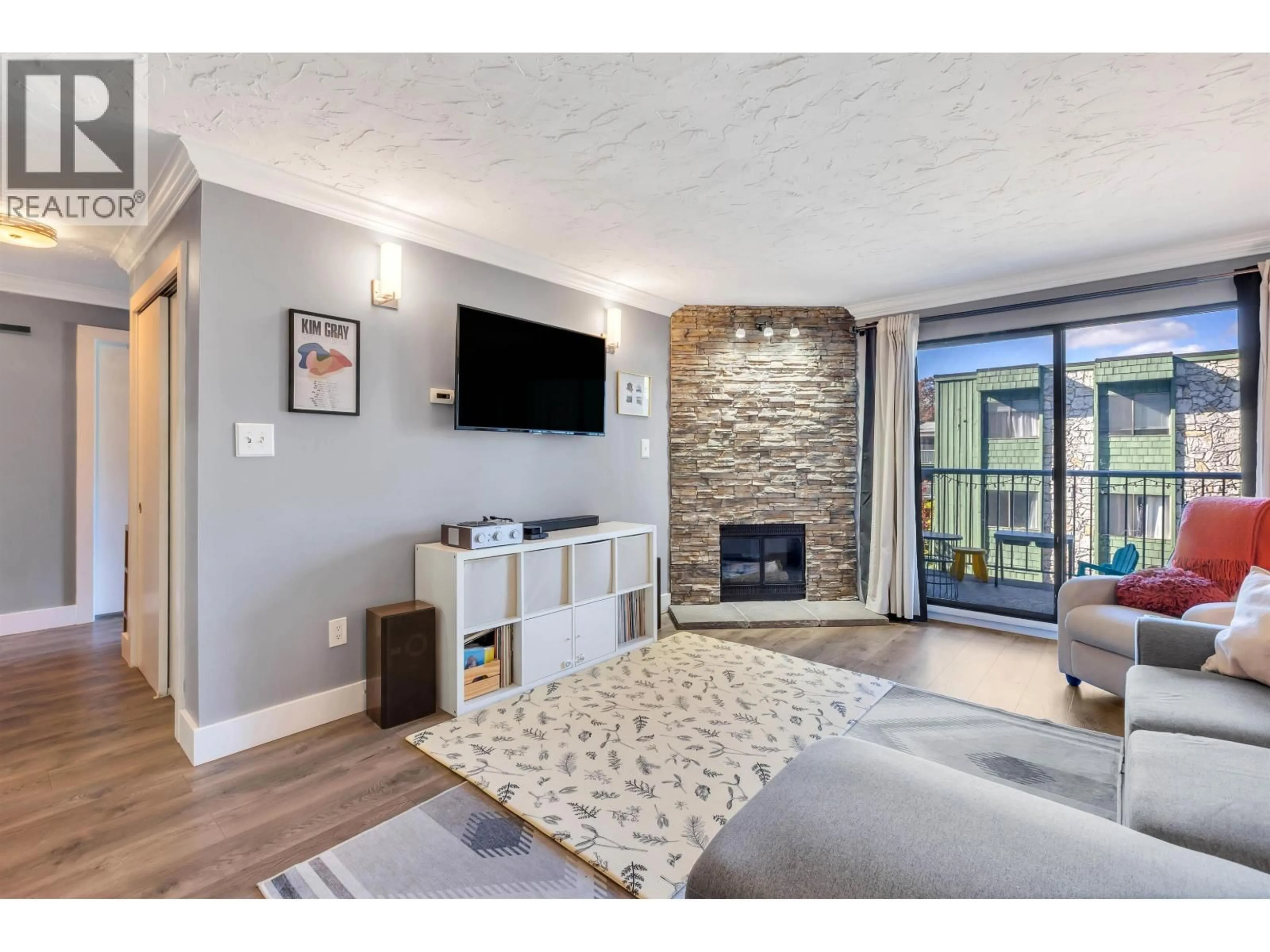 Living room with furniture, unknown for 207 - 3901 CARRIGAN COURT, Burnaby British Columbia V3N4K1