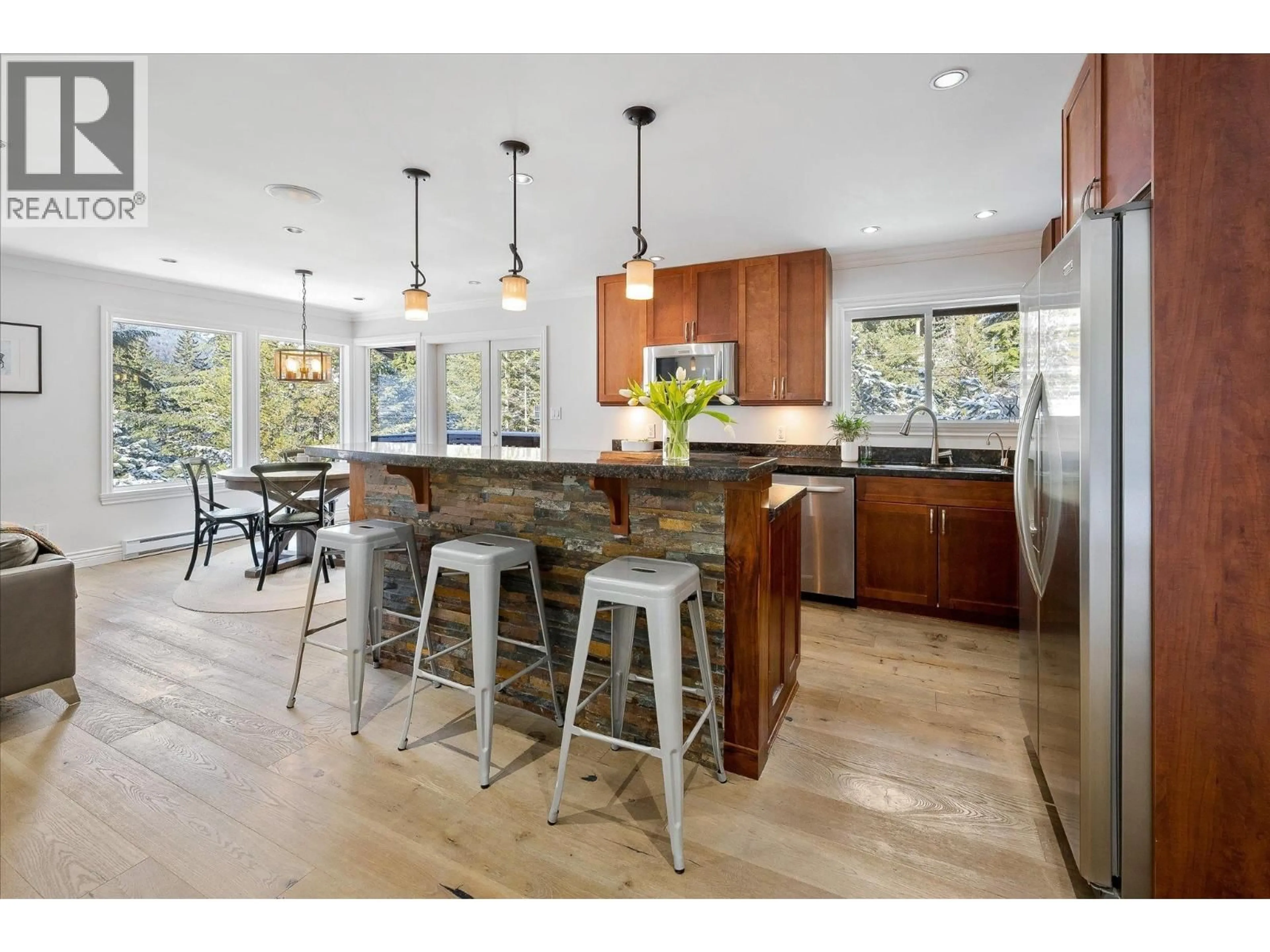 Open concept kitchen, wood/laminate floor for 3028 ST ANTON WAY, Whistler British Columbia V0N1O3