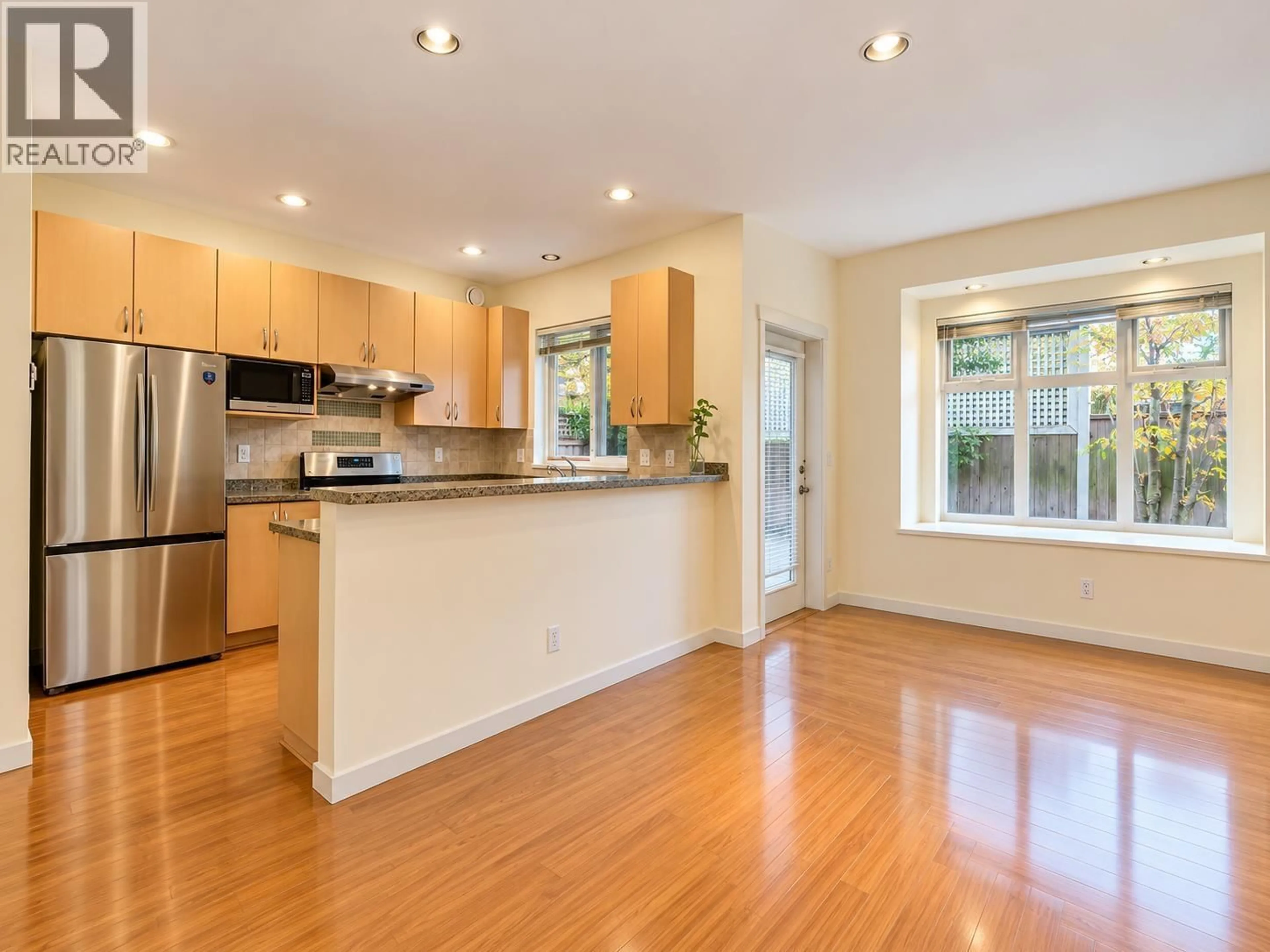 Open concept kitchen, wood/laminate floor for 16 - 8600 NO. 3 ROAD, Richmond British Columbia V6Y2E8