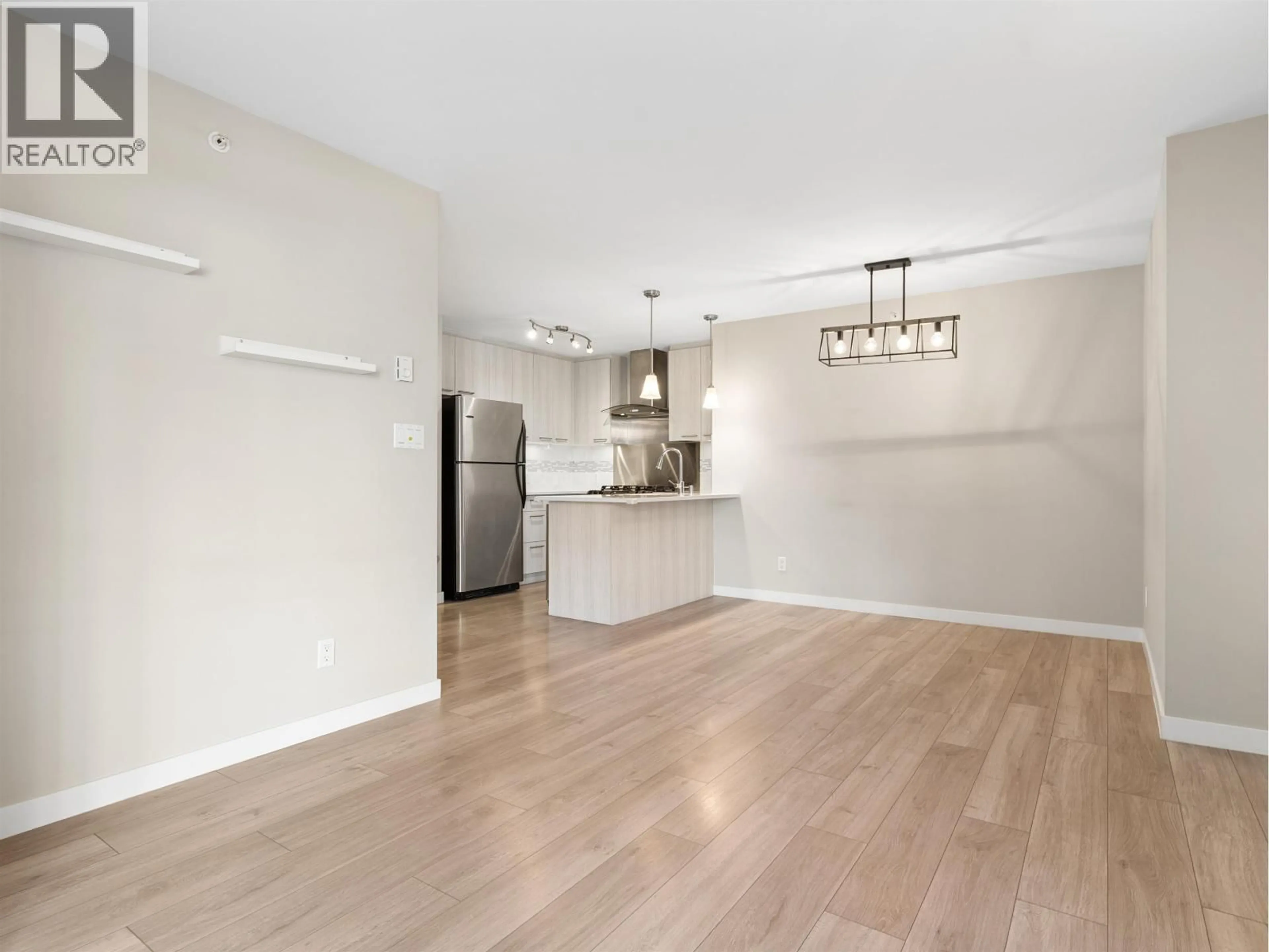 Open concept kitchen, wood/laminate floor for 219 - 8480 GRANVILLE AVENUE, Richmond British Columbia V6Y4E8