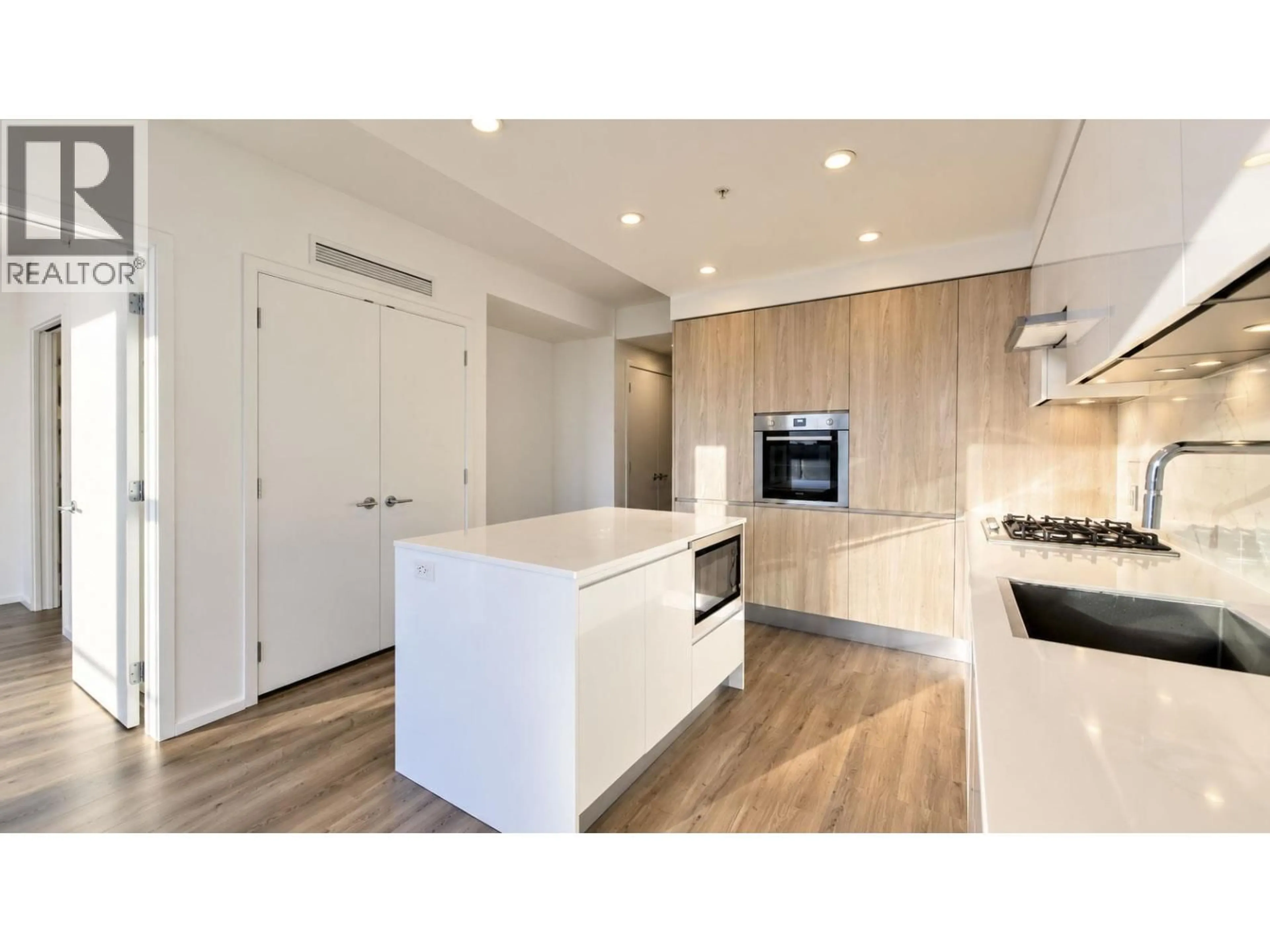 Open concept kitchen, wood/laminate floor for 1805 - 3888 EVERGREEN PLACE, Burnaby British Columbia V3J0M3