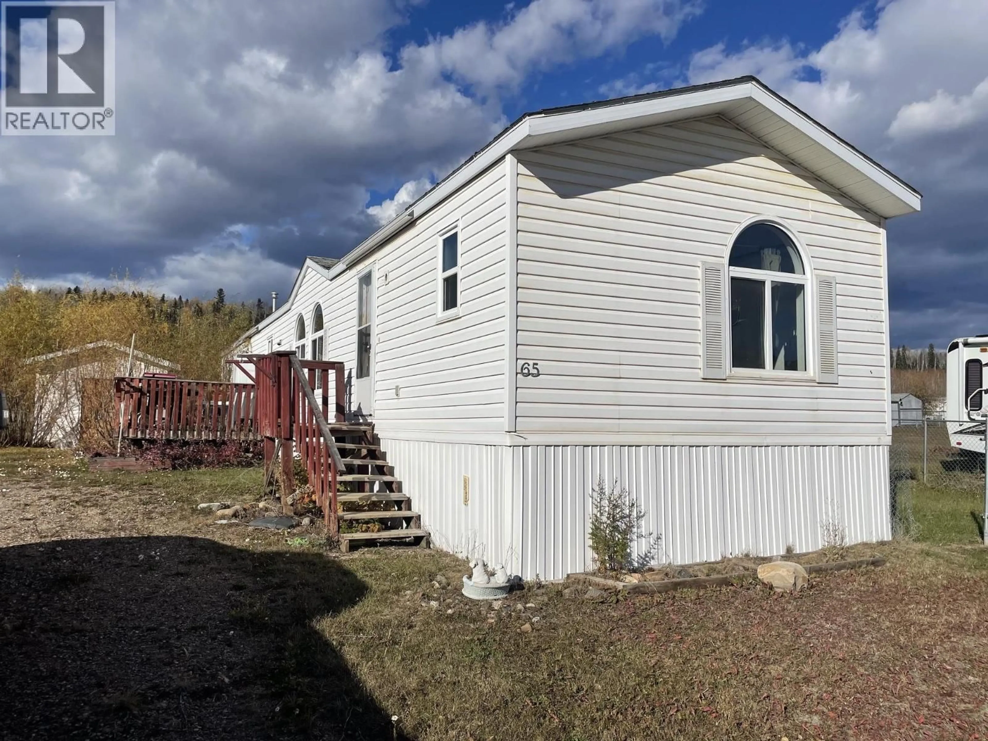Home with vinyl exterior material, unknown for 65 - 5701 AIRPORT DRIVE, Fort Nelson British Columbia V0C1R0