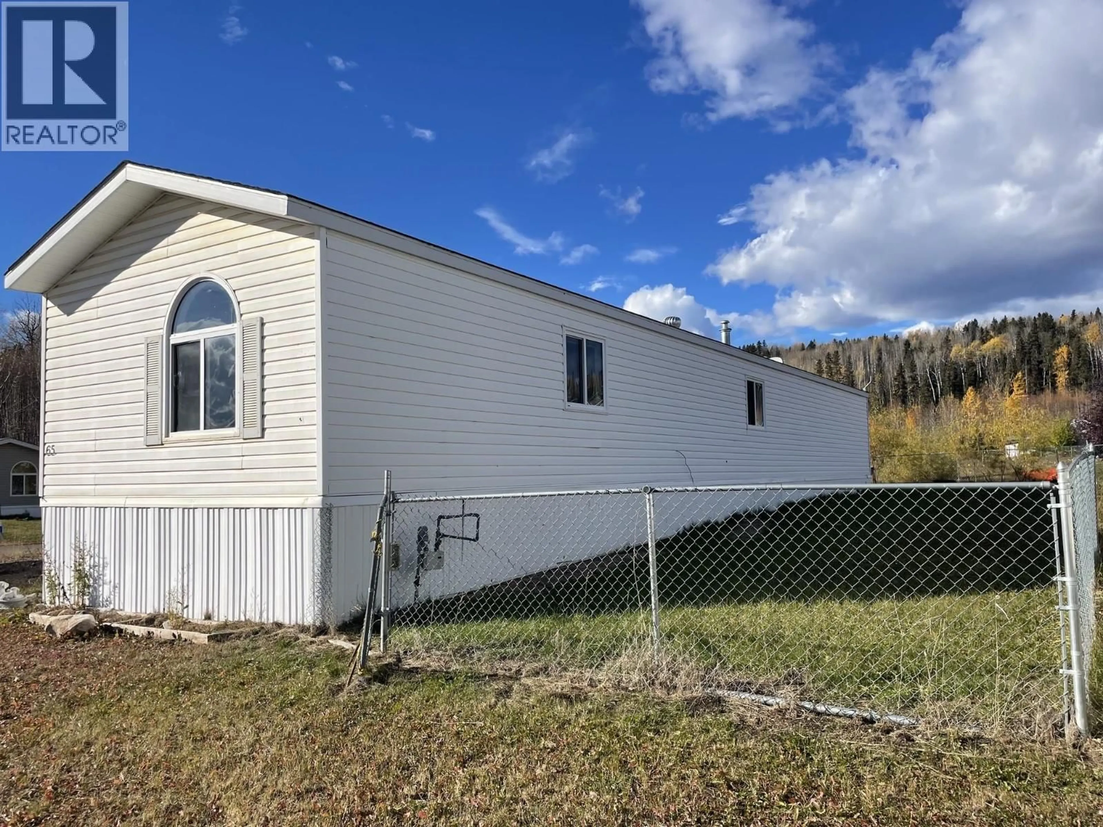 Home with vinyl exterior material, building for 65 - 5701 AIRPORT DRIVE, Fort Nelson British Columbia V0C1R0