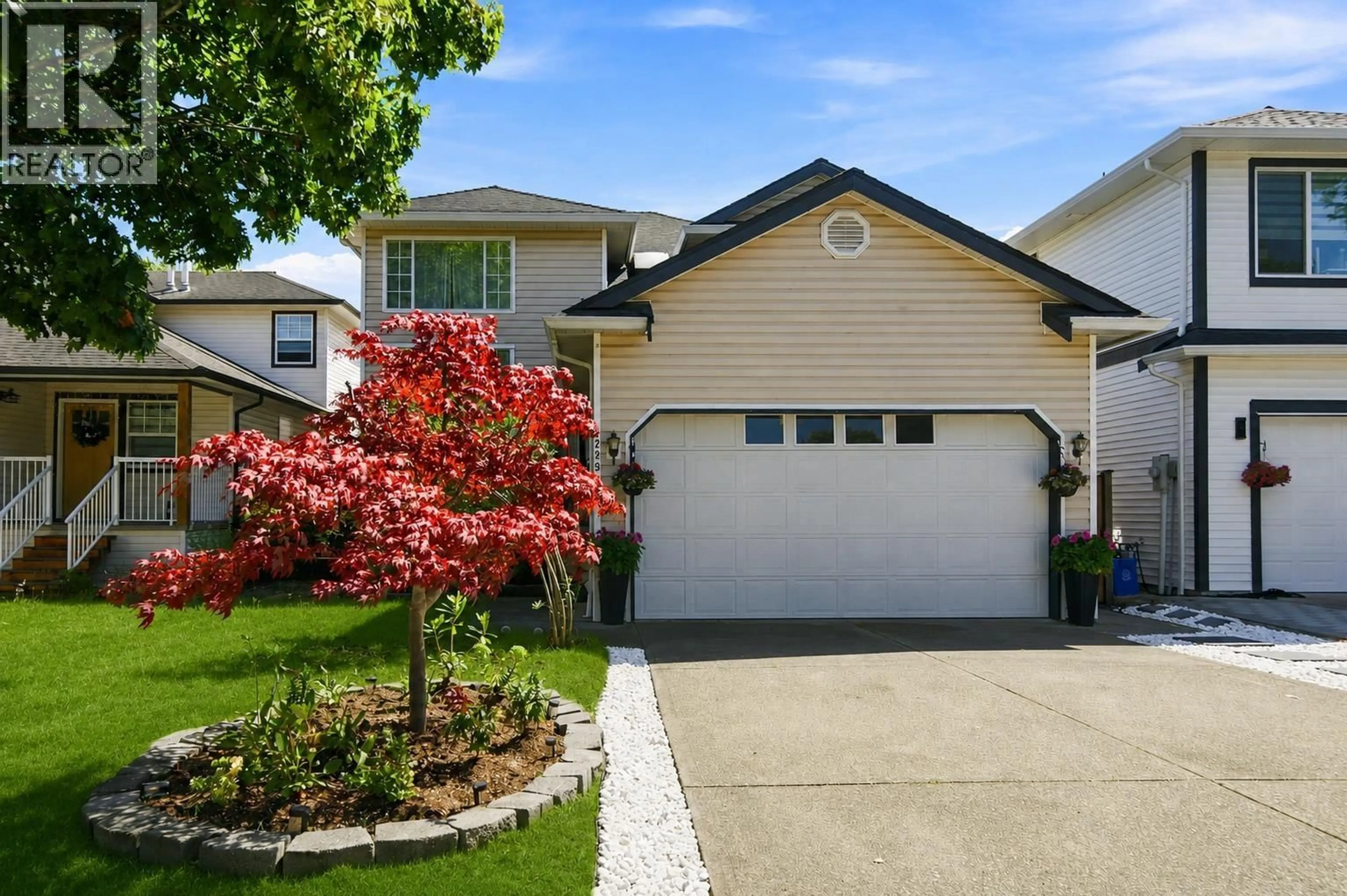 Home with vinyl exterior material, street for 22291 GARRATT DRIVE, Richmond British Columbia V6V2P6