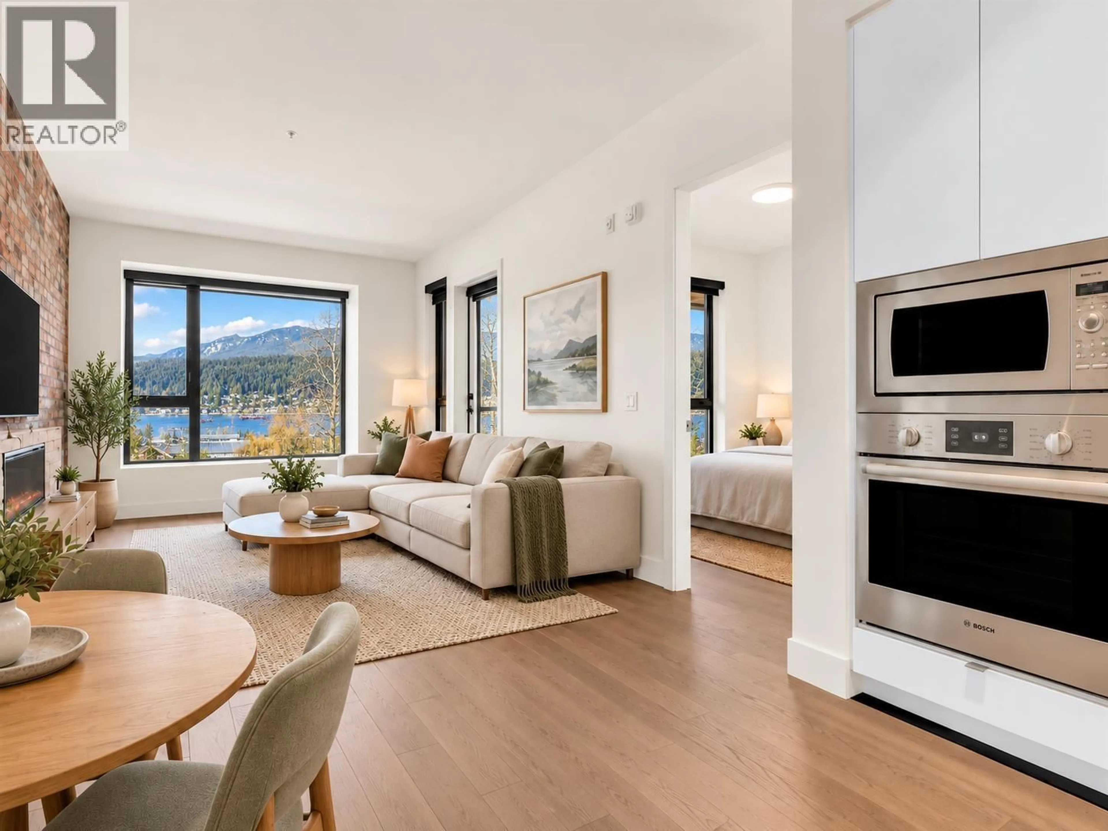 Living room with furniture, wood/laminate floor for 407 - 83 MOODY STREET, Port Moody British Columbia V3H0K7