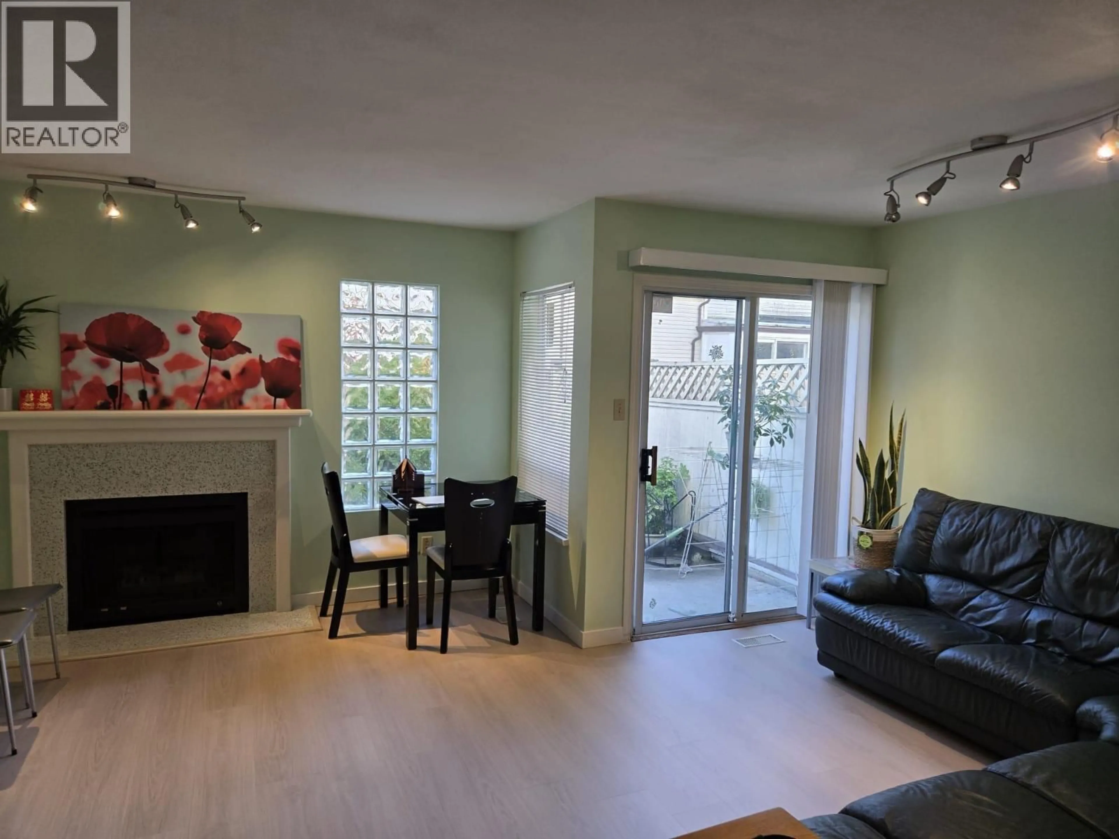 Living room with furniture, unknown for 11 - 6391 COONEY ROAD, Richmond British Columbia V6Y2J5