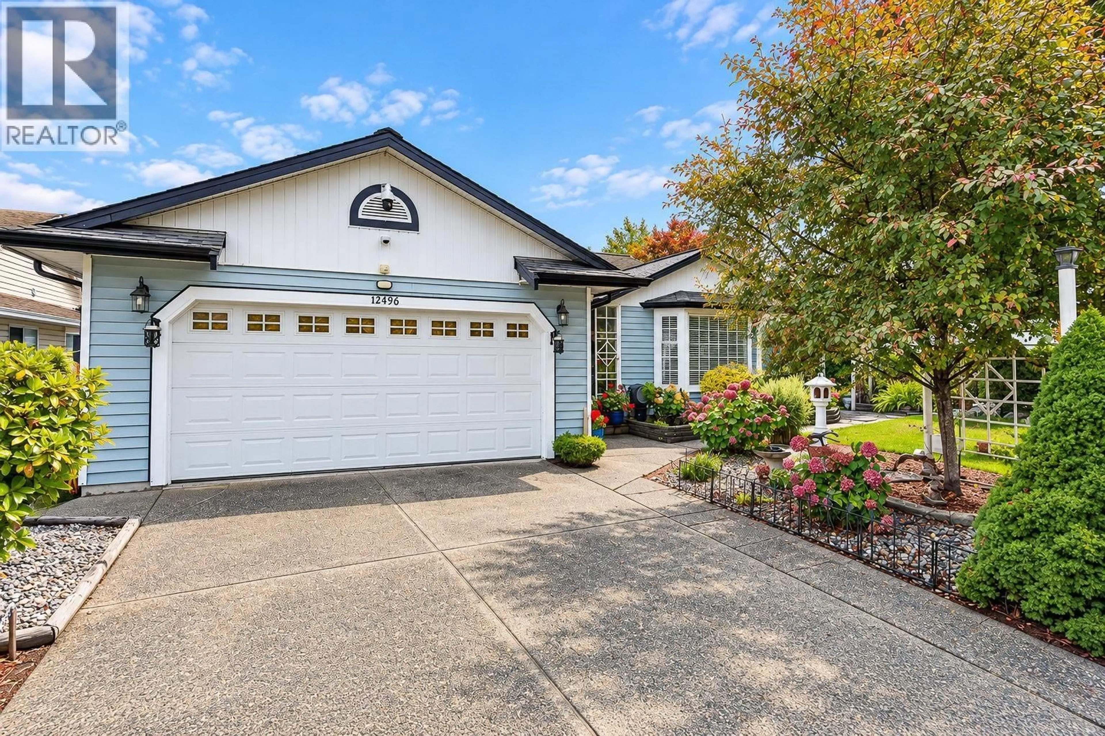 Home with vinyl exterior material, street for 12496 219TH STREET, Maple Ridge British Columbia V2X0V3