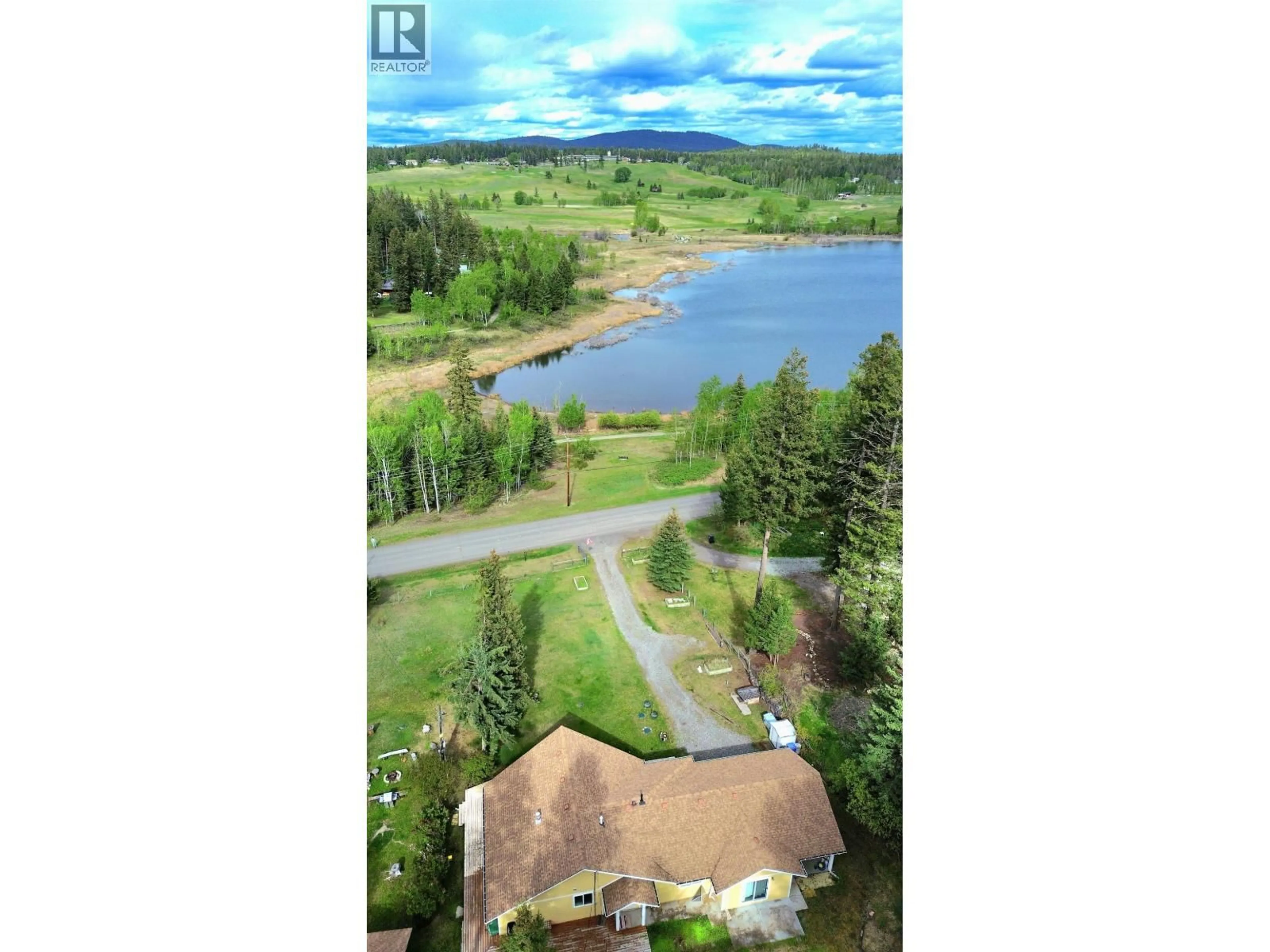 A pic from outside/outdoor area/front of a property/back of a property/a pic from drone, water/lake/river/ocean view for 5328 KALLUM DRIVE, 108 Mile Ranch British Columbia V0K2Z0