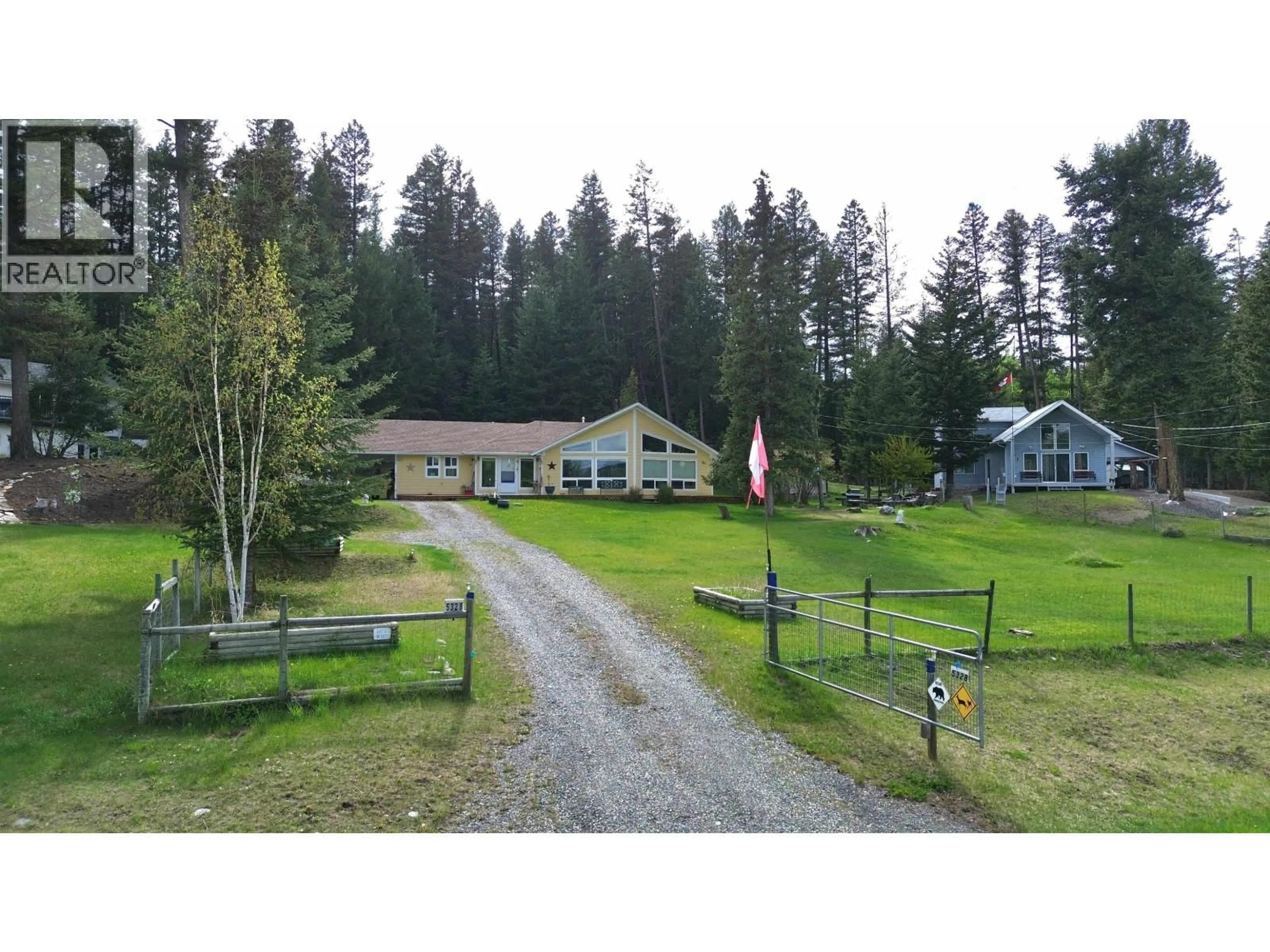 A pic from outside/outdoor area/front of a property/back of a property/a pic from drone, mountain view for 5328 KALLUM DRIVE, 108 Mile Ranch British Columbia V0K2Z0