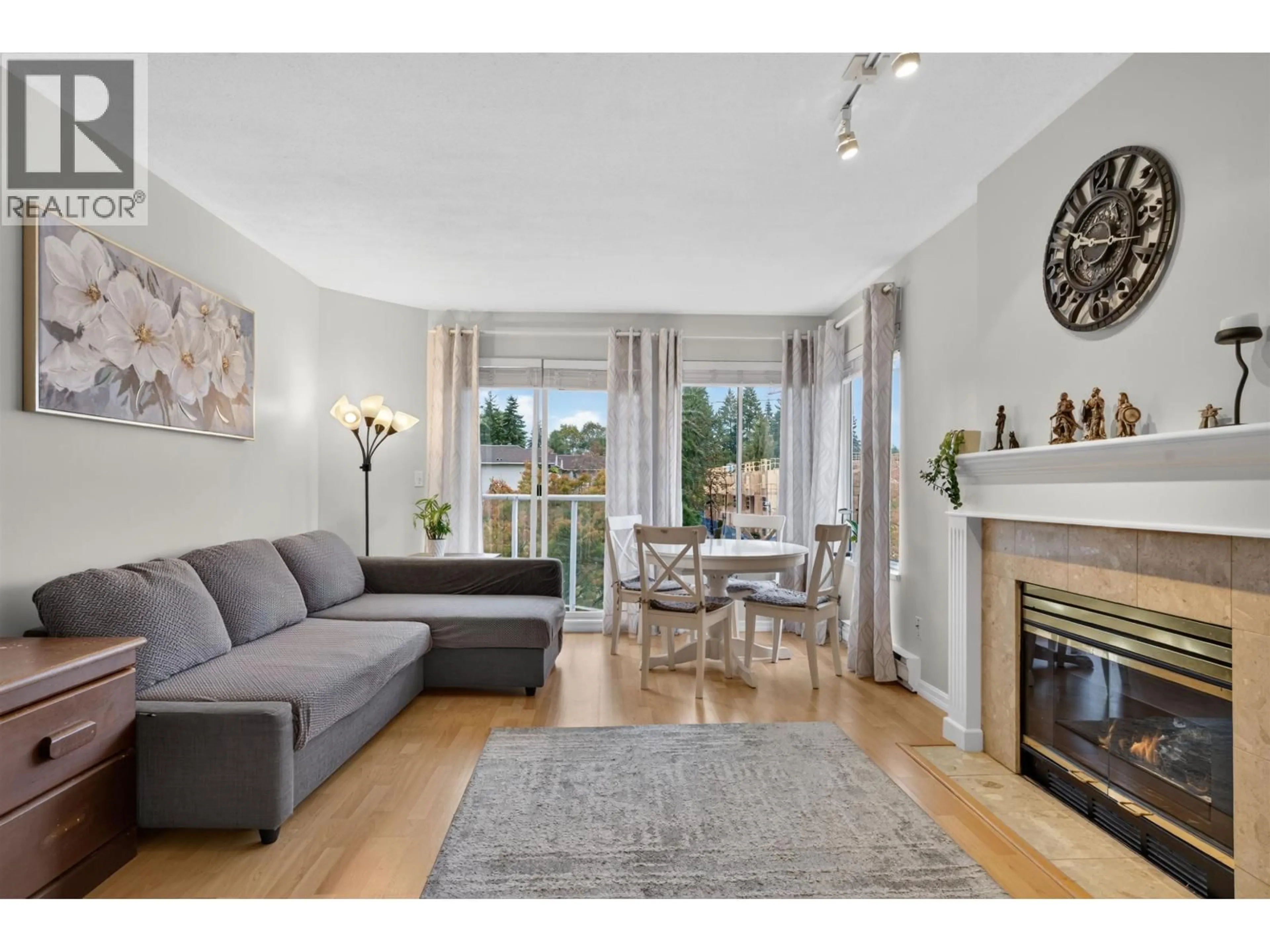 Living room with furniture, wood/laminate floor for 303 - 1171 PIPELINE ROAD, Coquitlam British Columbia V3B4R9