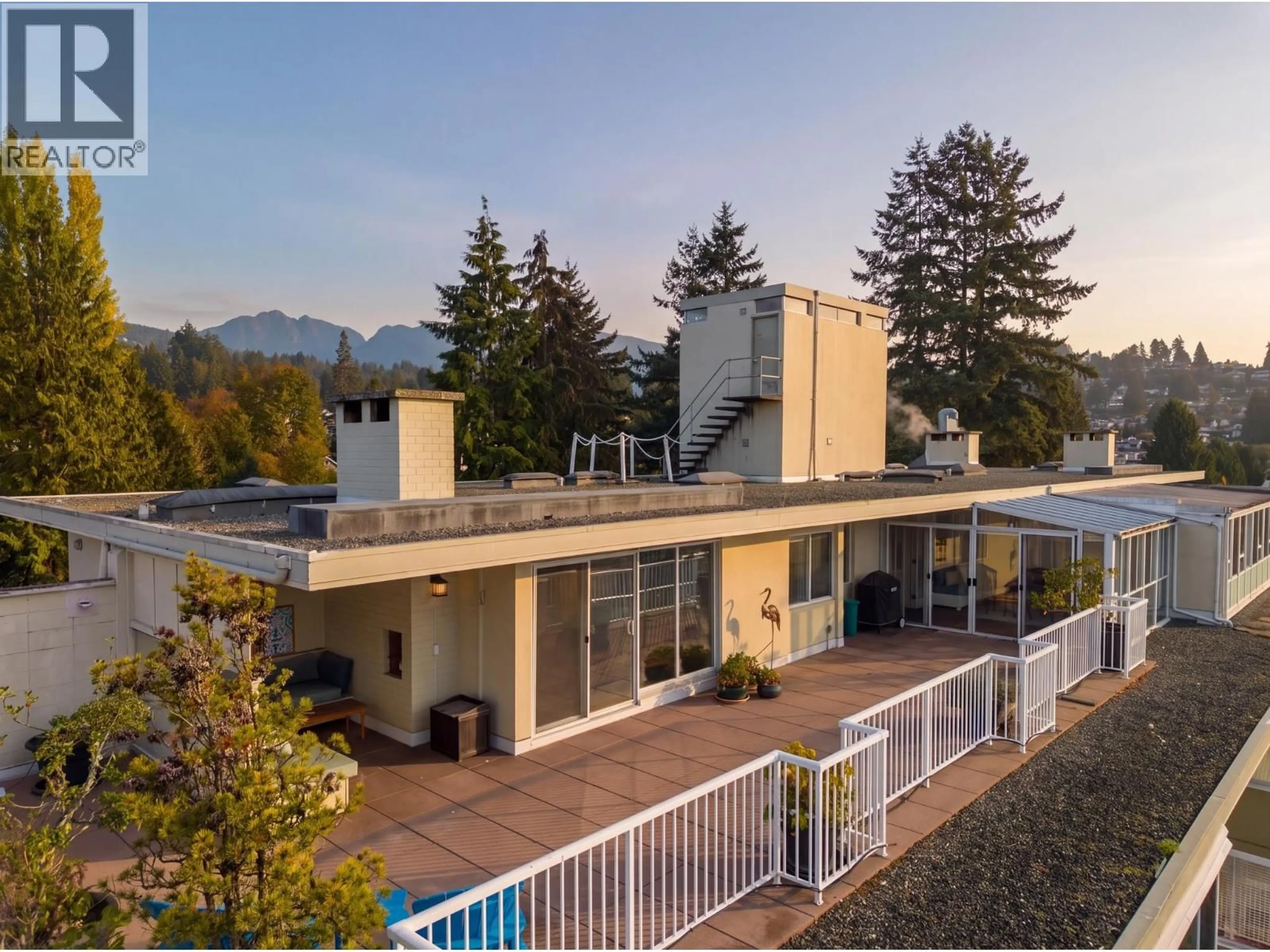 A pic from outside/outdoor area/front of a property/back of a property/a pic from drone, mountain view for 701 - 1425 ESQUIMALT AVENUE, West Vancouver British Columbia V7T1L1