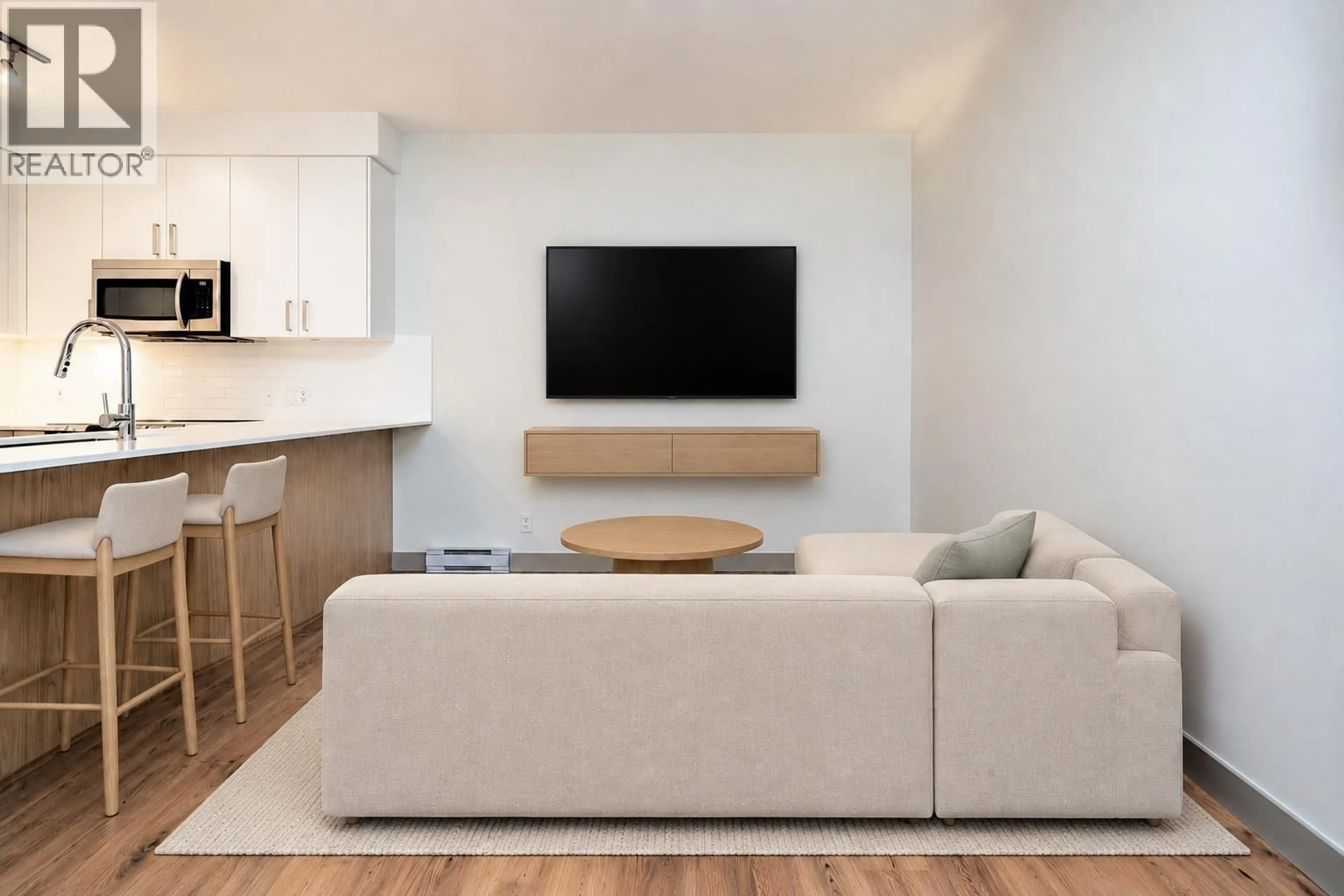 Living room with furniture, wood/laminate floor for 209 - 6968 ROYAL OAK AVENUE, Burnaby British Columbia V5J4J2