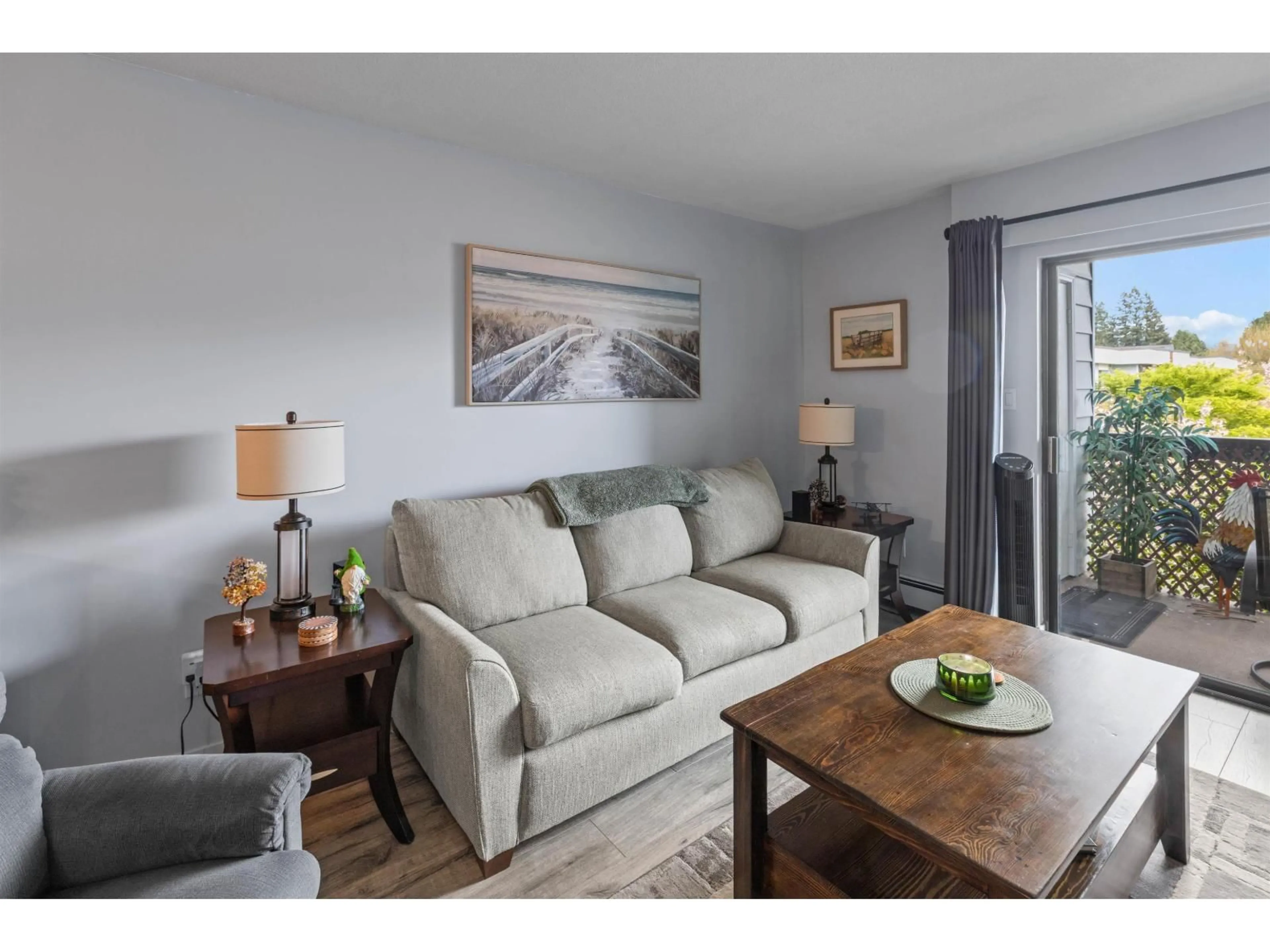 Living room with furniture, wood/laminate floor for 307 - 2279 MCCALLUM ROAD, Abbotsford British Columbia V2S3N7