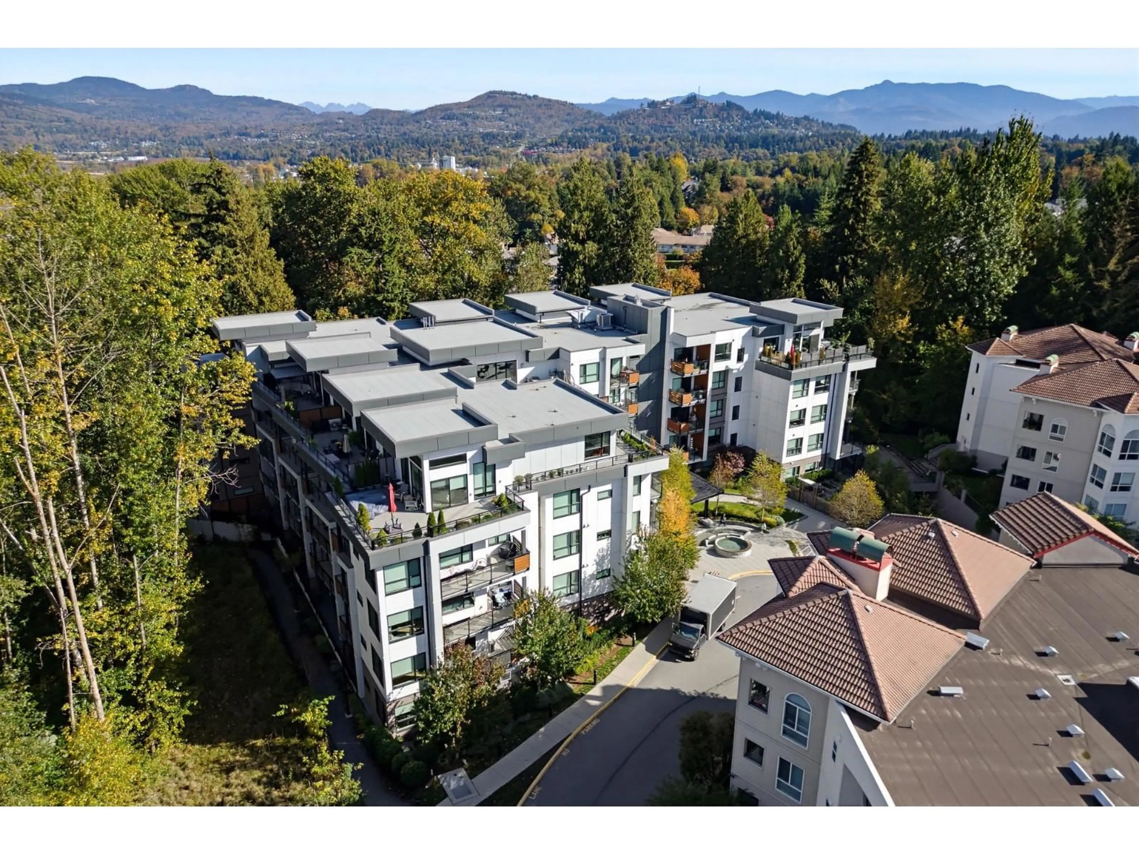 A pic from outside/outdoor area/front of a property/back of a property/a pic from drone, mountain view for 205 - 3182 GLADWIN ROAD, Abbotsford British Columbia V2T0K8