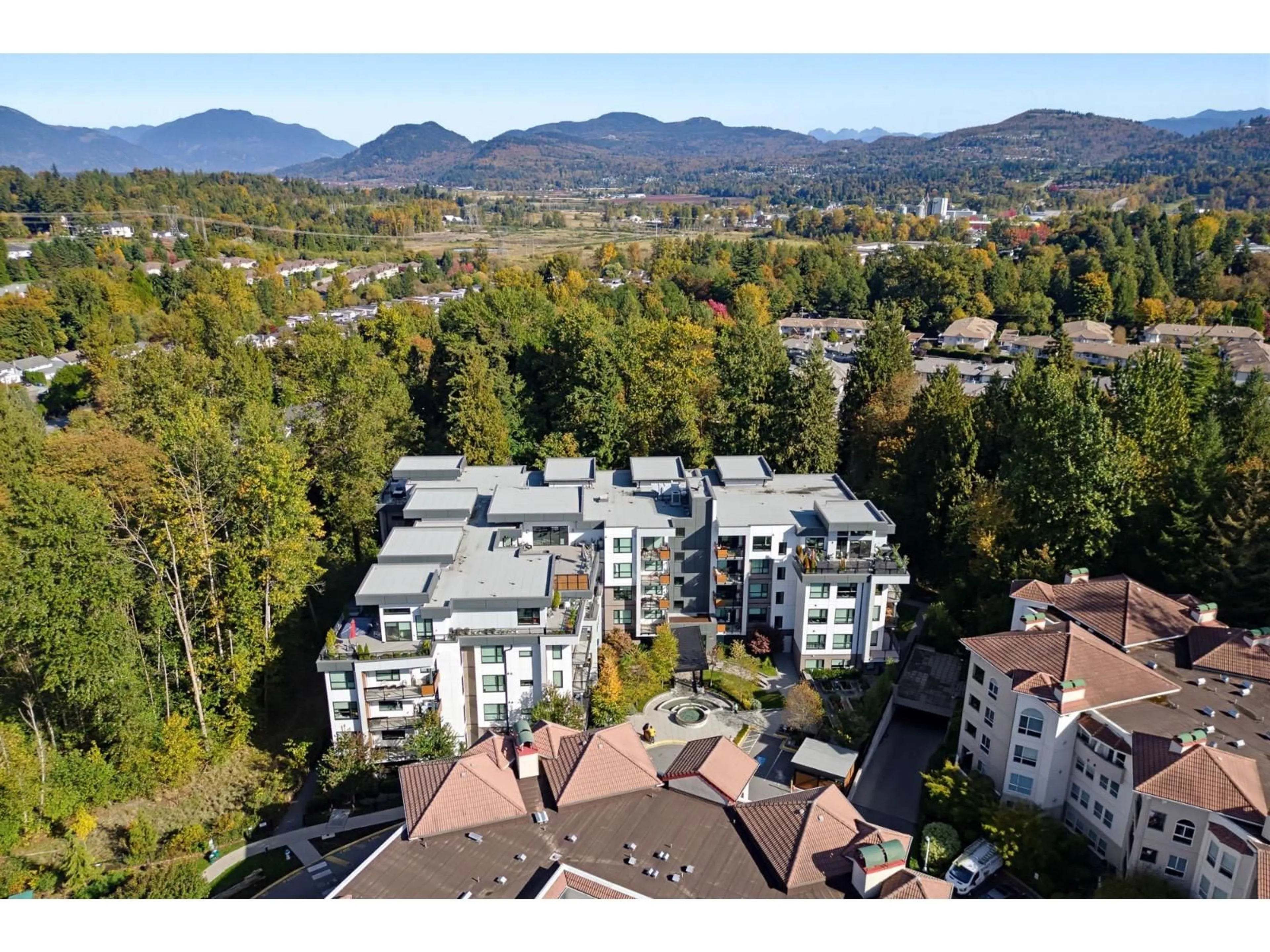 A pic from outside/outdoor area/front of a property/back of a property/a pic from drone, mountain view for 205 - 3182 GLADWIN ROAD, Abbotsford British Columbia V2T0K8