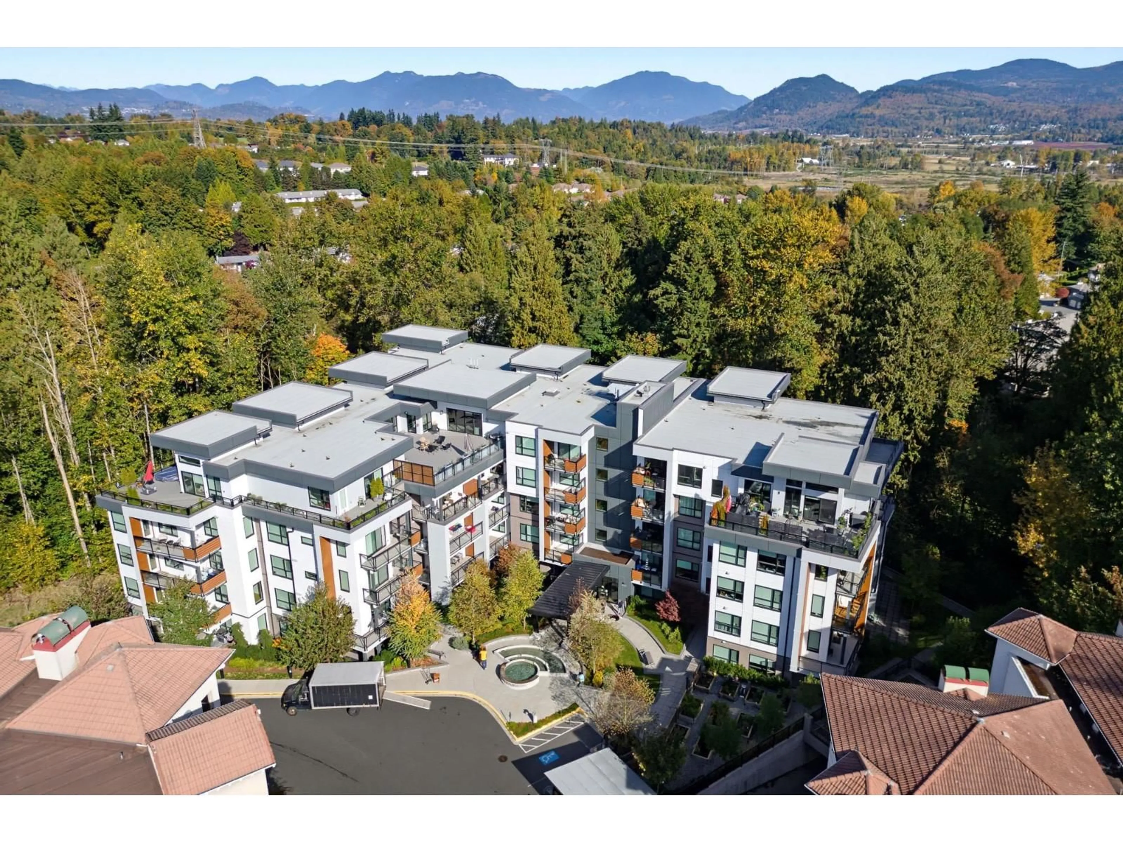 A pic from outside/outdoor area/front of a property/back of a property/a pic from drone, mountain view for 205 - 3182 GLADWIN ROAD, Abbotsford British Columbia V2T0K8
