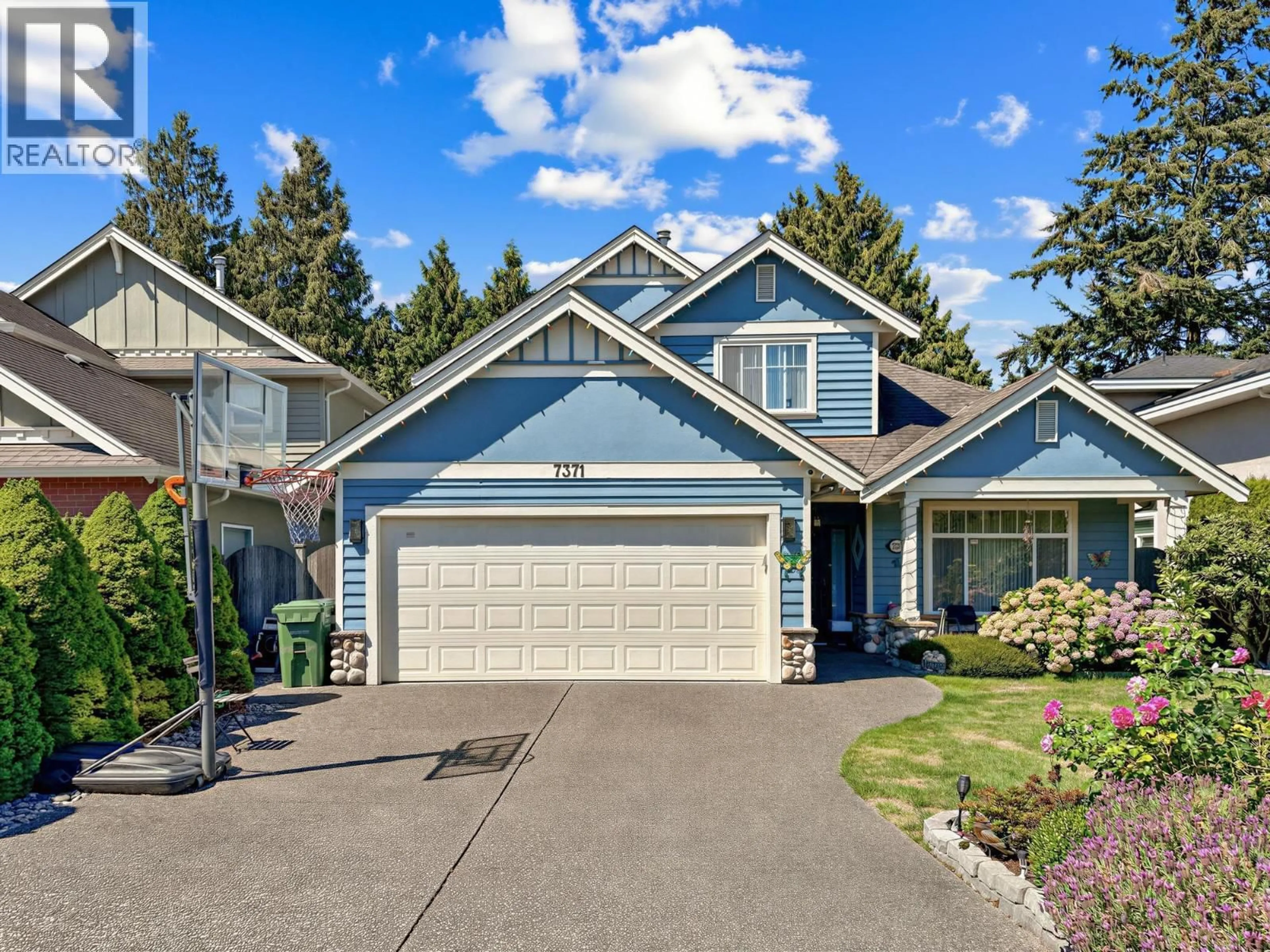 Home with vinyl exterior material, street for 7371 LINDSAY ROAD, Richmond British Columbia V7C3M7