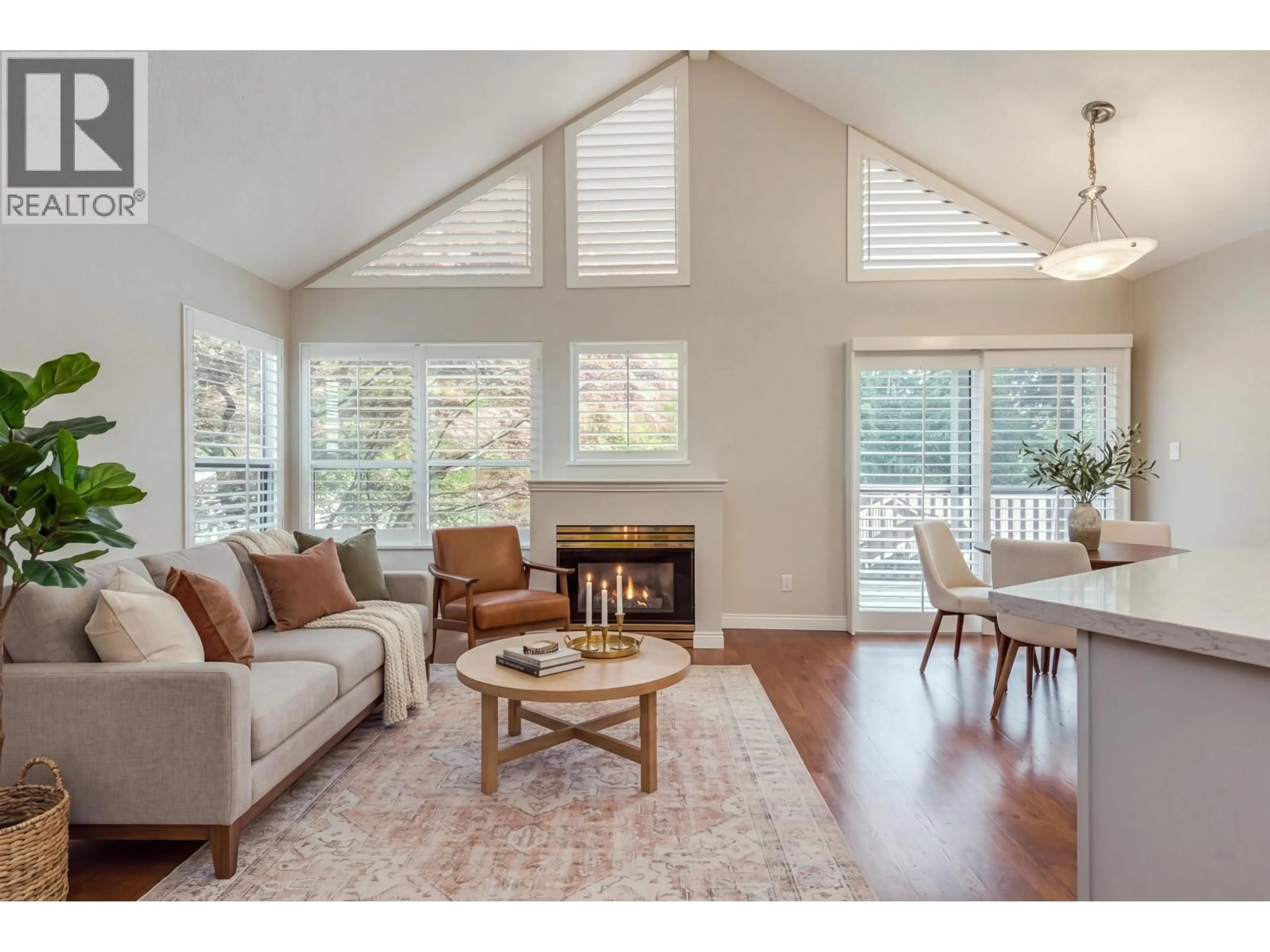 Living room with furniture, wood/laminate floor for 29 - 4055 INDIAN RIVER DRIVE, North Vancouver British Columbia V7G2R7