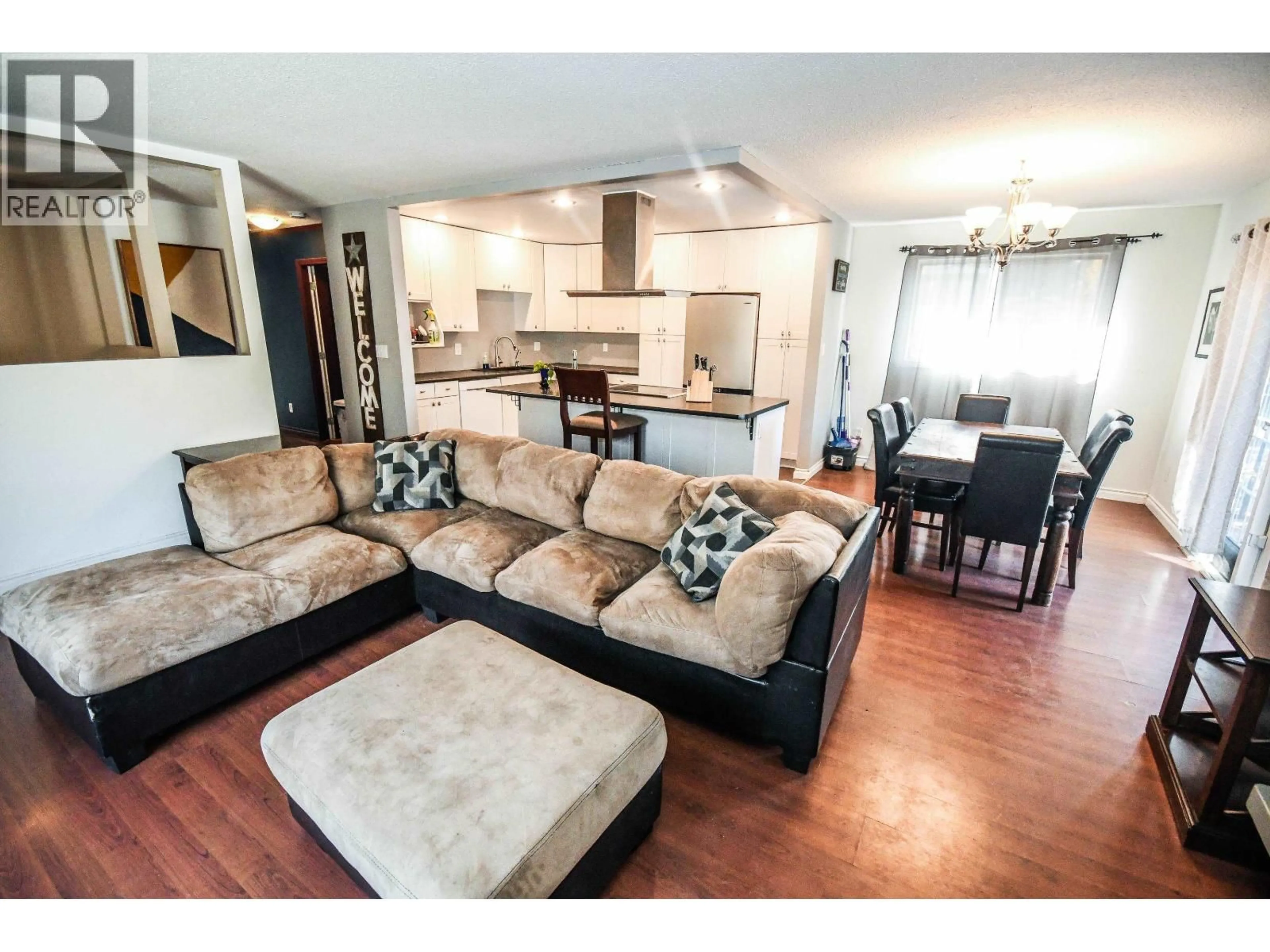 Living room with furniture, wood/laminate floor for 122 DUNCAN PLACE, Prince George British Columbia V2M6T4