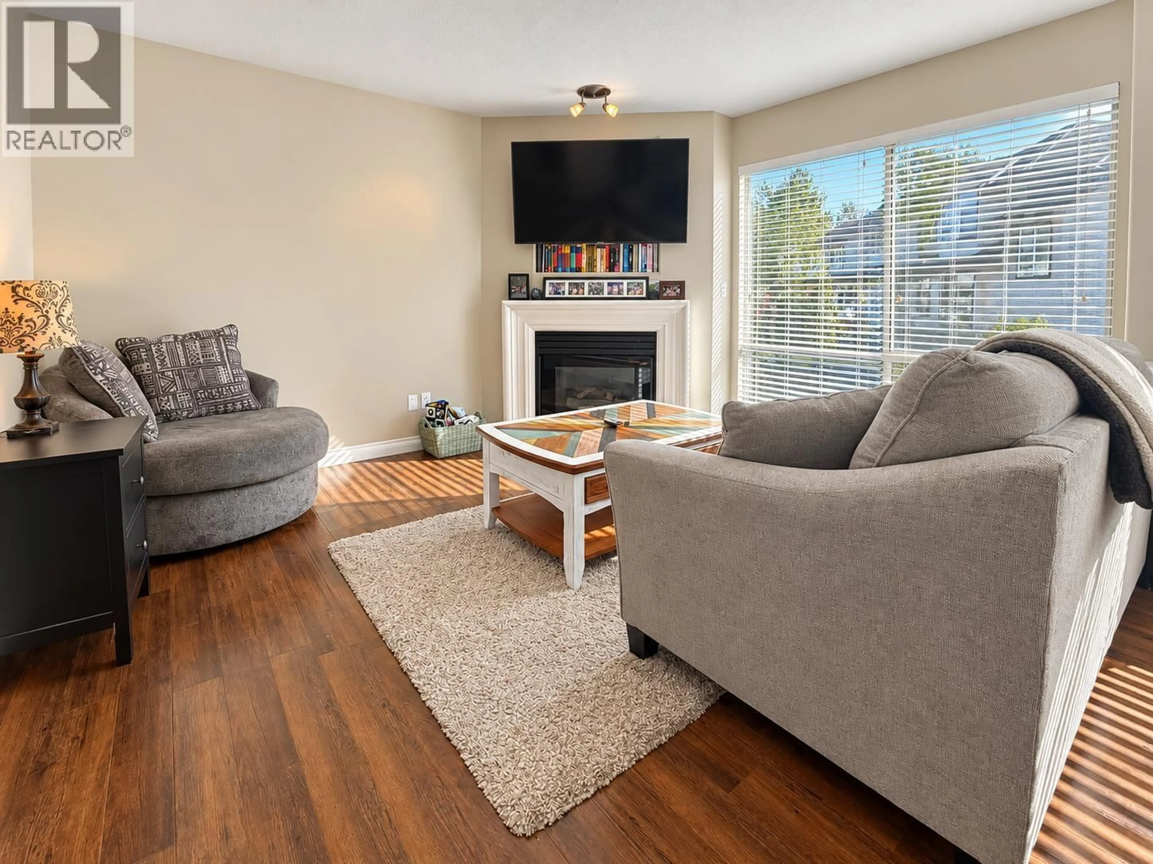 Living room with furniture, wood/laminate floor for 35 - 2450 LOBB AVENUE, Port Coquitlam British Columbia V3C6G8